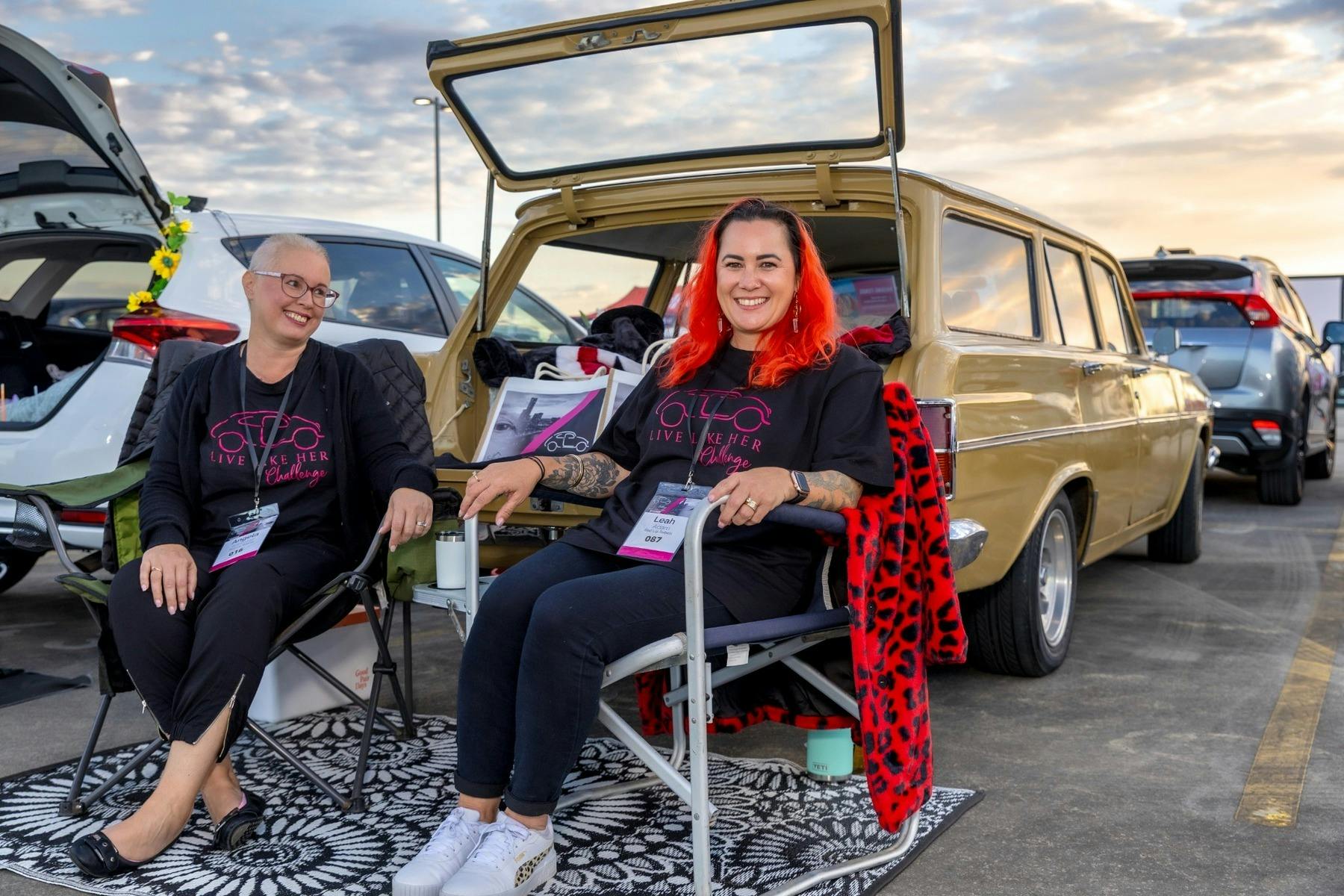 Two Gold Coast Live Like Her Challenge participants sitting in camp chairs beside a vintage station