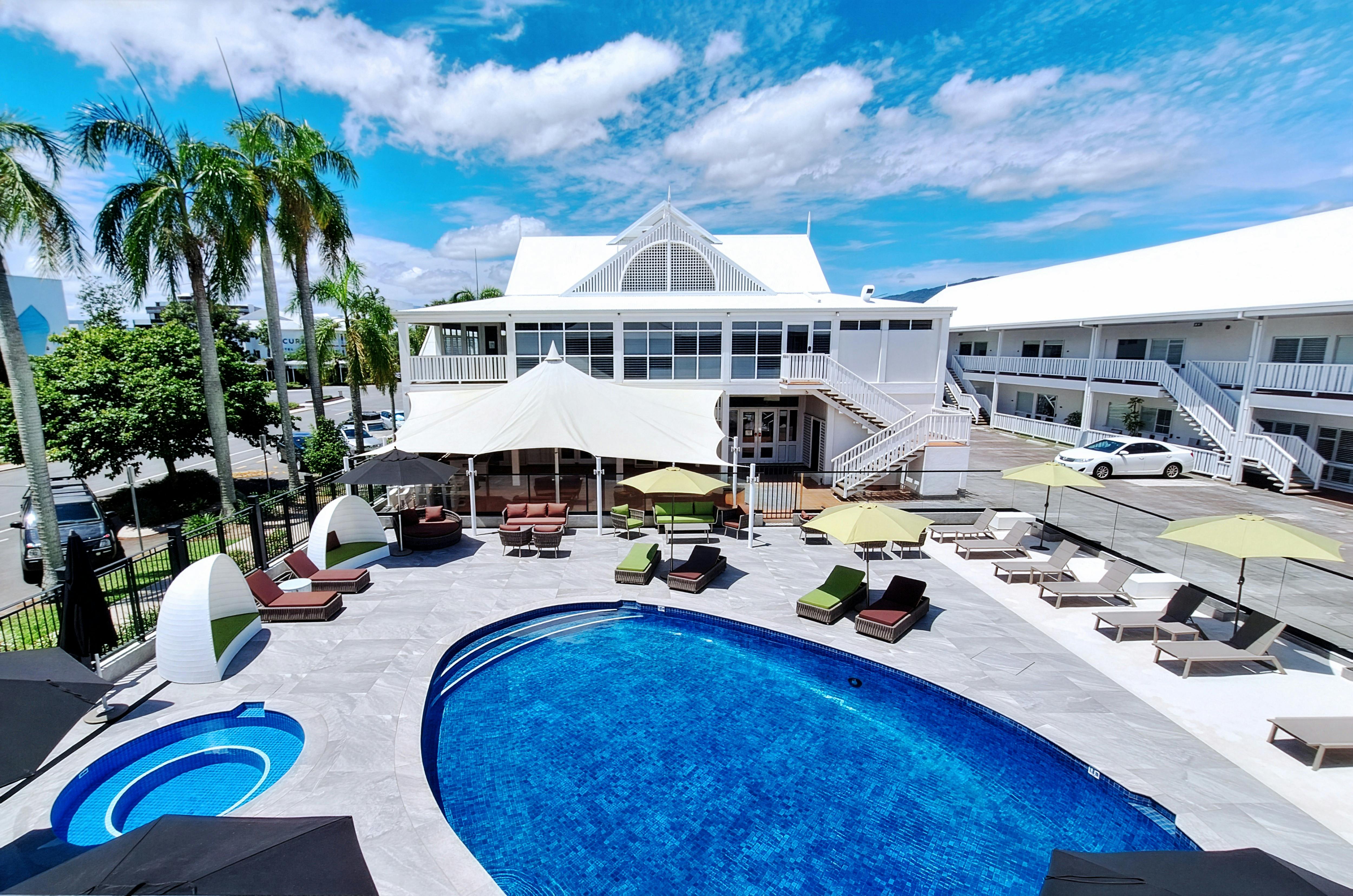 Fully renovated and modernized pool area with sandy beach.