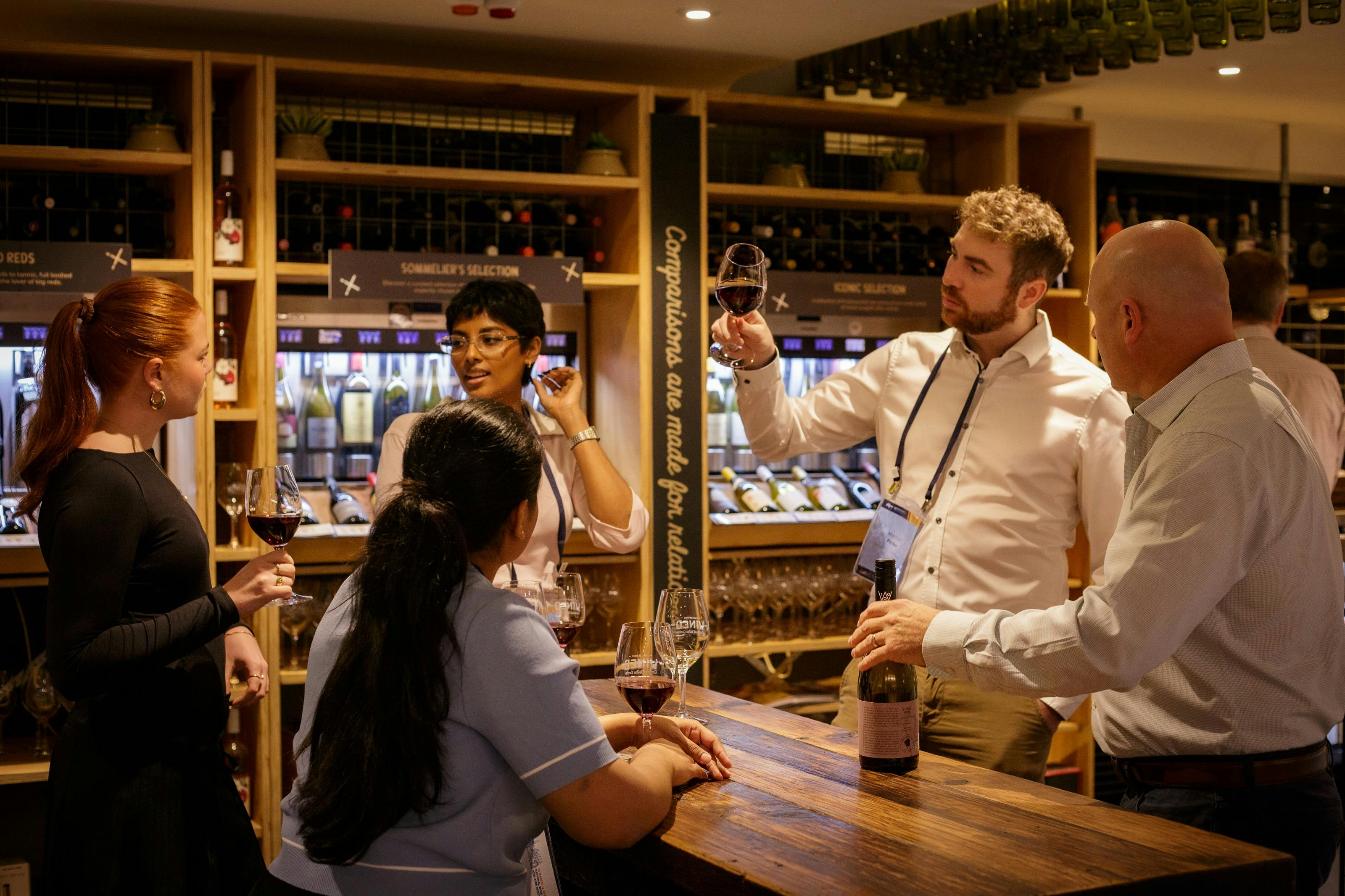 visitors being guided through wine tasting