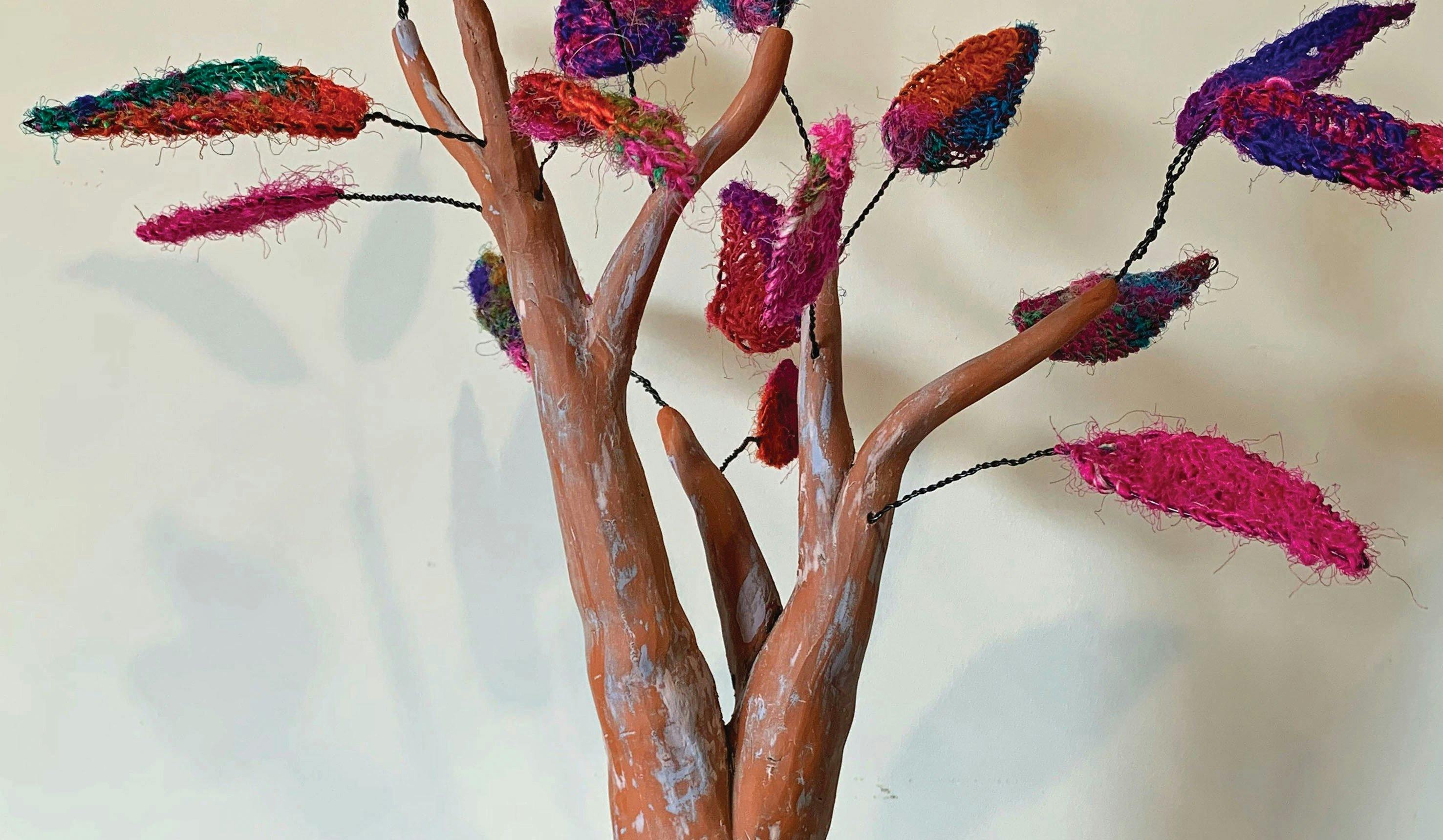 Ceramic sculptural tree with knitted fibre leaves