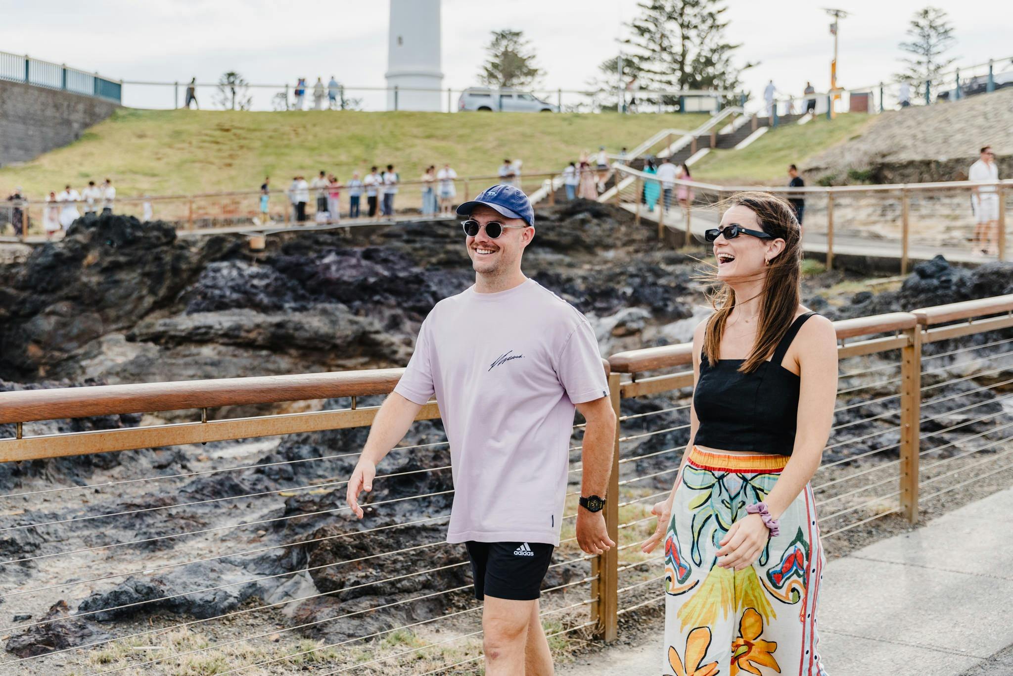 two people walking next to Kiama Blowhole