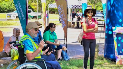 a man in a wheelchair with a microphone