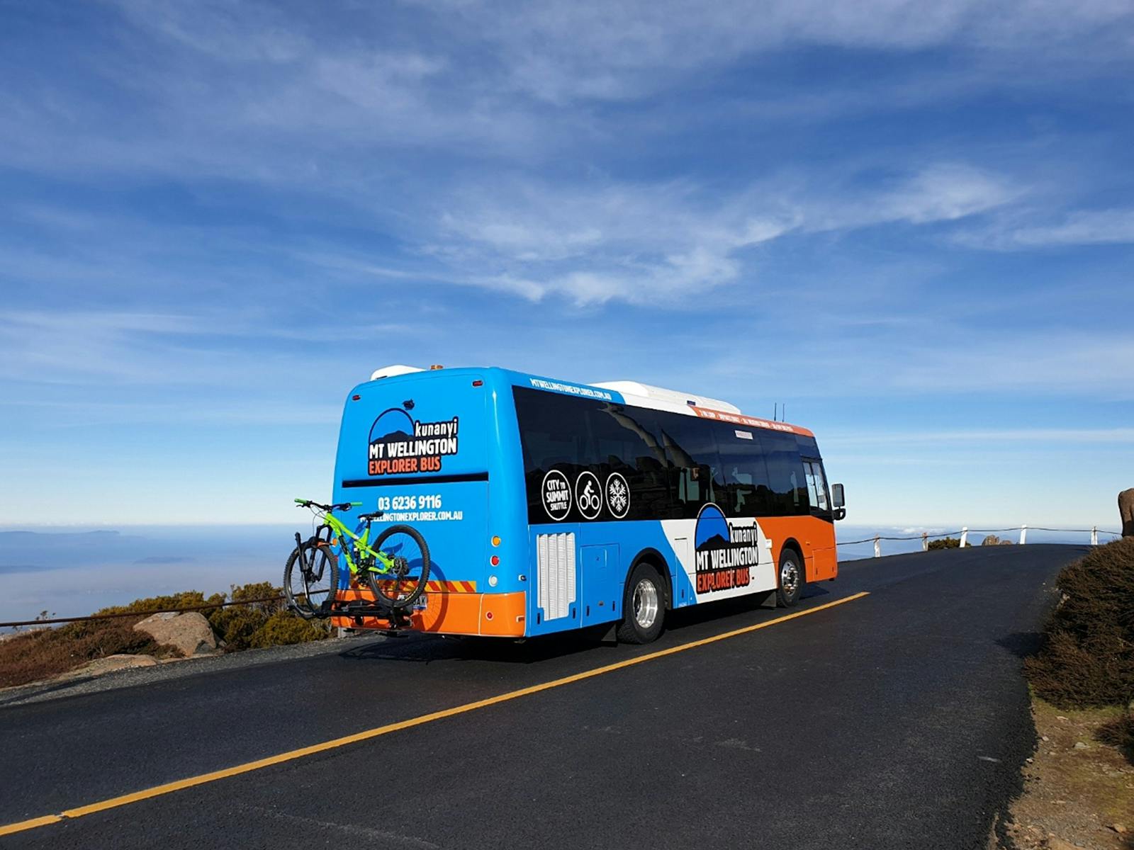 kunanyi/Mt Wellington Explorer Bus with a bike on the bike rack.