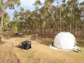 Part of your private stay, from above: our Soulfire wood fired sauna and a dome in the foreground.