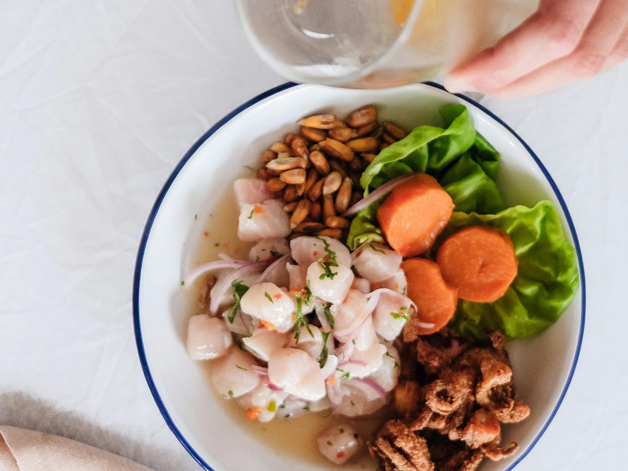 Image of a seafood dish and a glass of beer