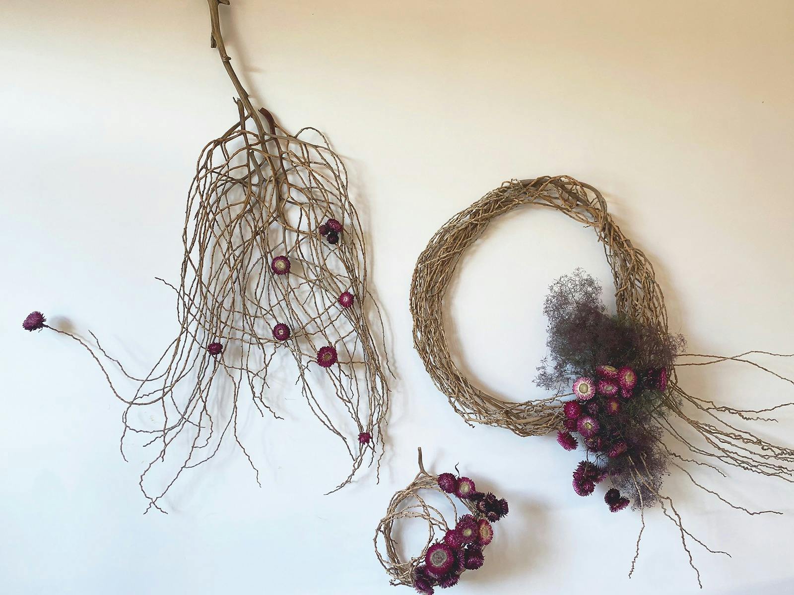 Three fibre wall piece with flowers