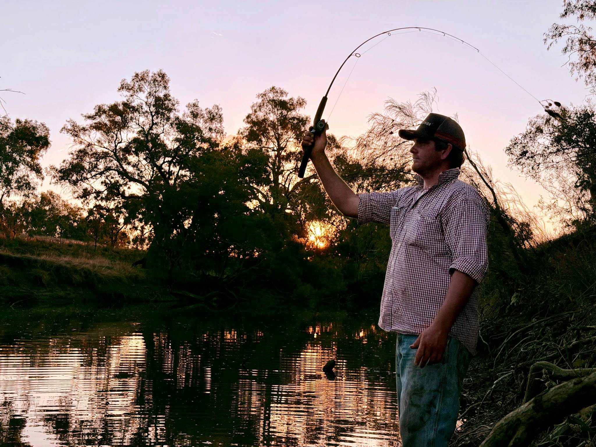 Fishing on the banks of the Warrego River Fishing on the banks of the Warrego River