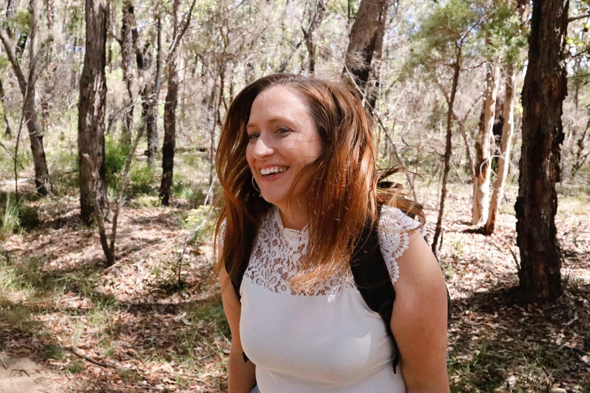 Lady walking with smile and flowing hair