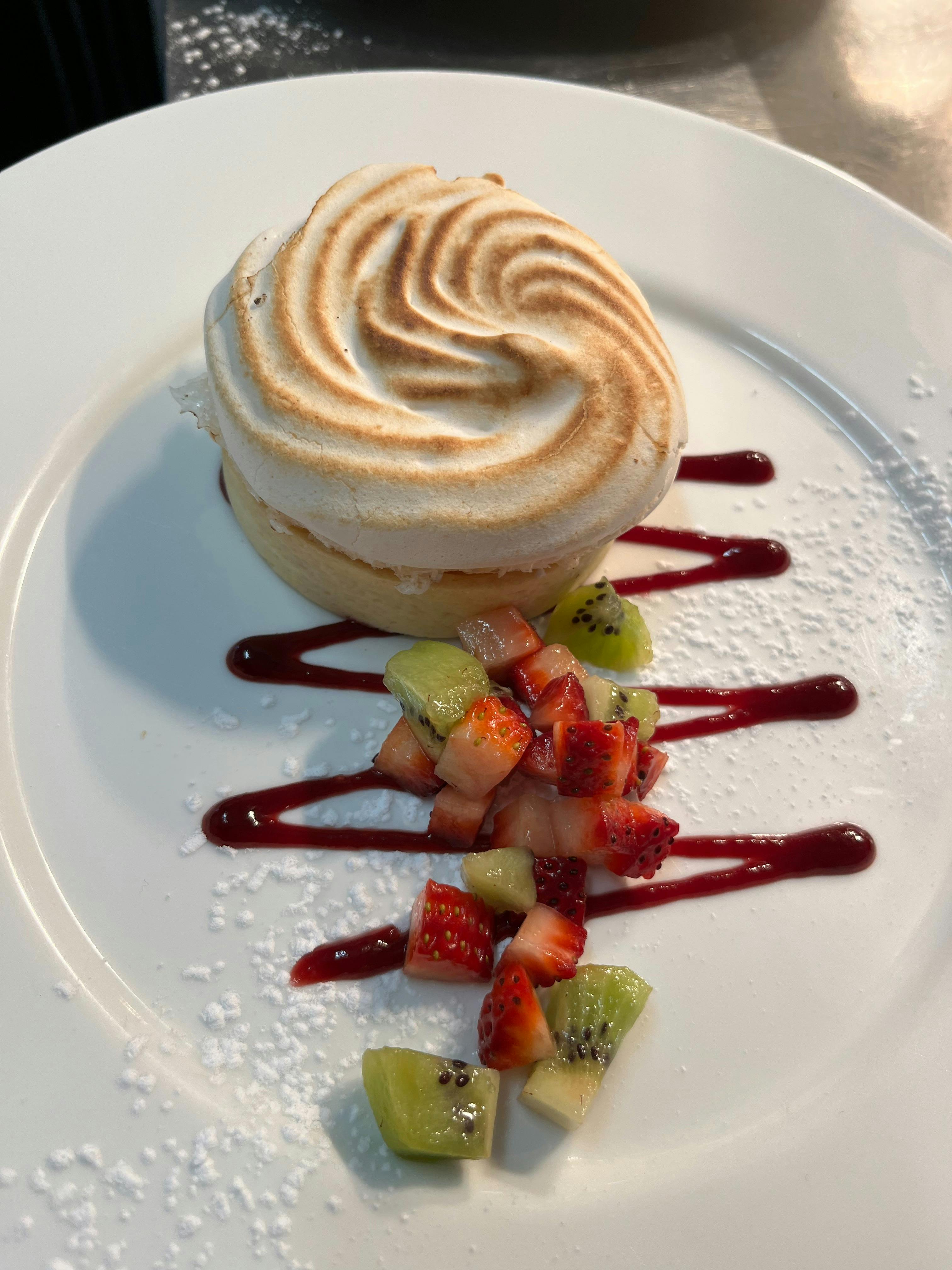 crispy merengue with a selection of healthy fresh fruits and a decorative galze for a fresh crispy d