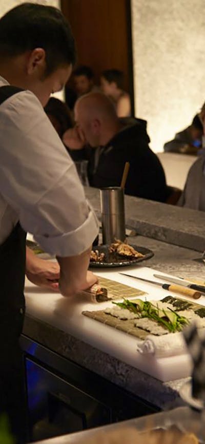 Chefs cooking at bar