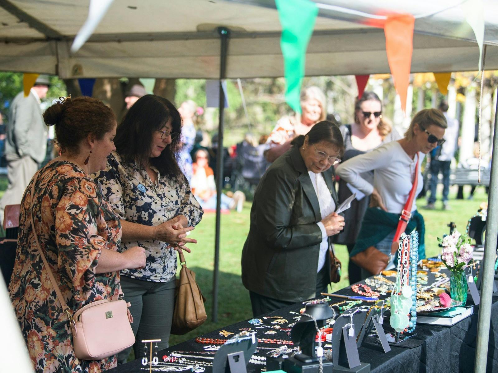 People browsing market stalls