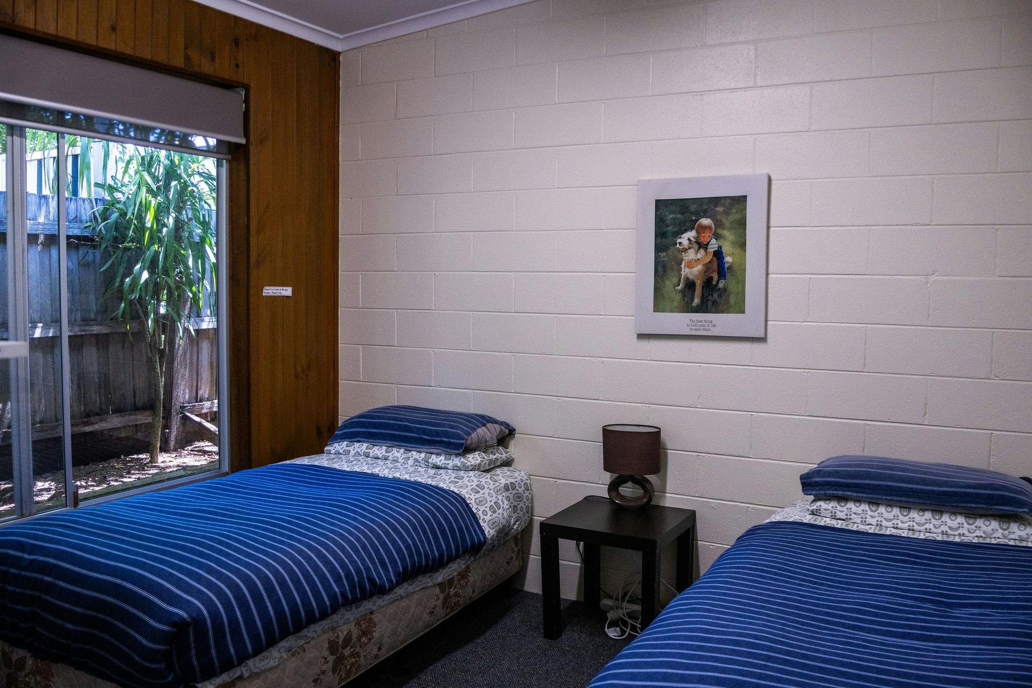 Second bedroom with two single beds in a Silver Bream Motel unit