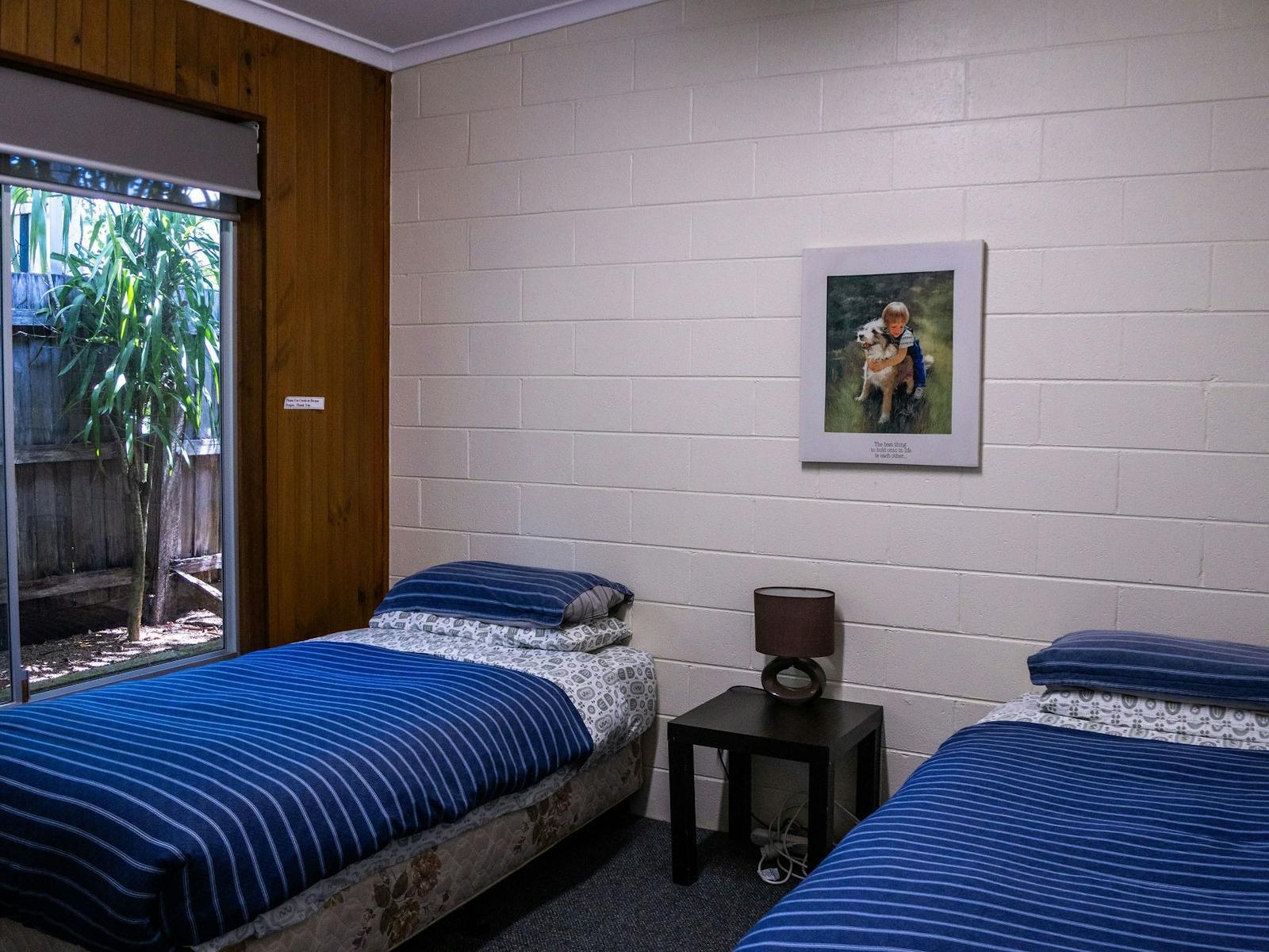 Second bedroom with two single beds in a Silver Bream Motel unit