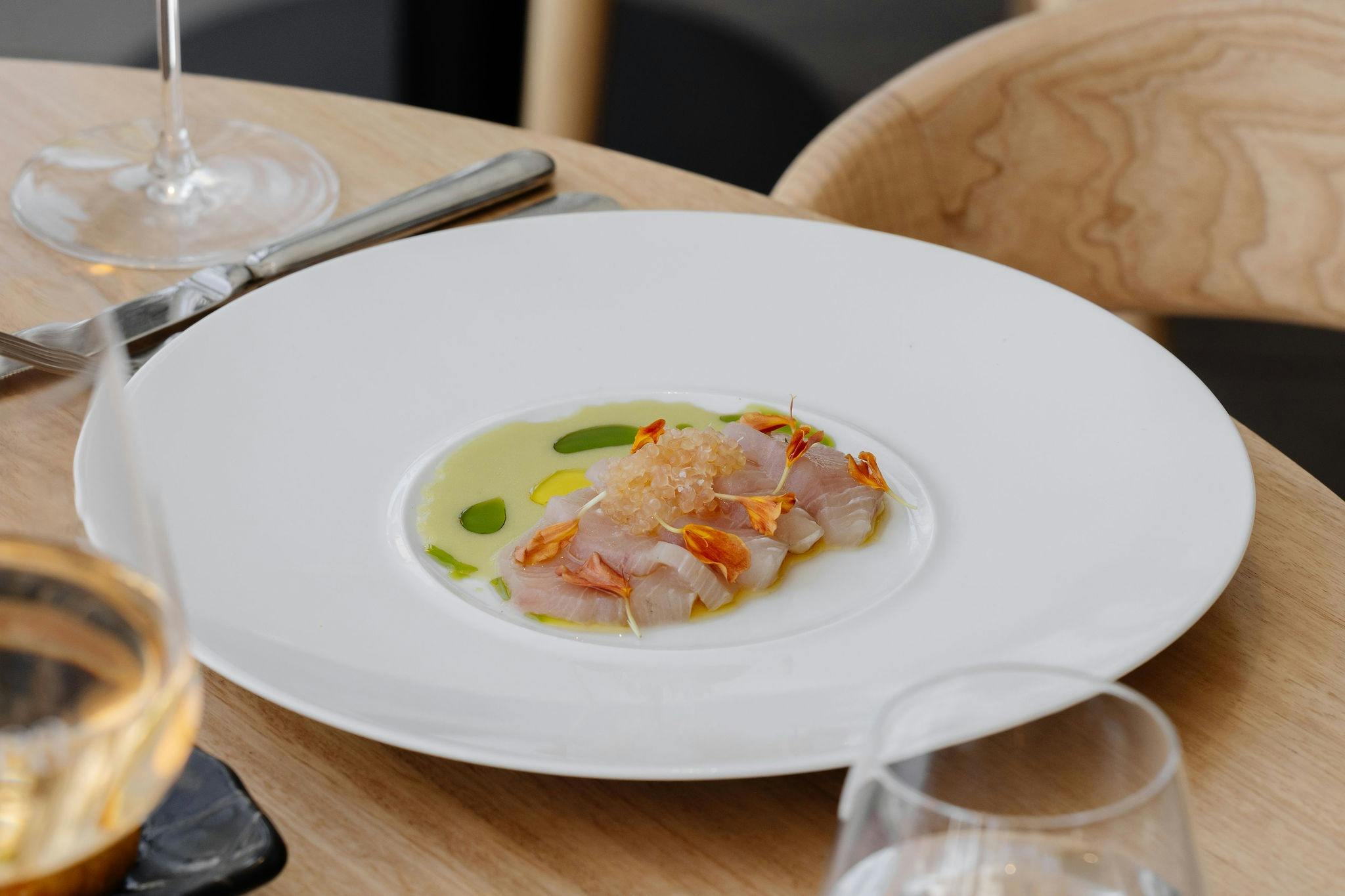 Cured kingfish with crisp cucumber, cultured buttermilk & finger lime.