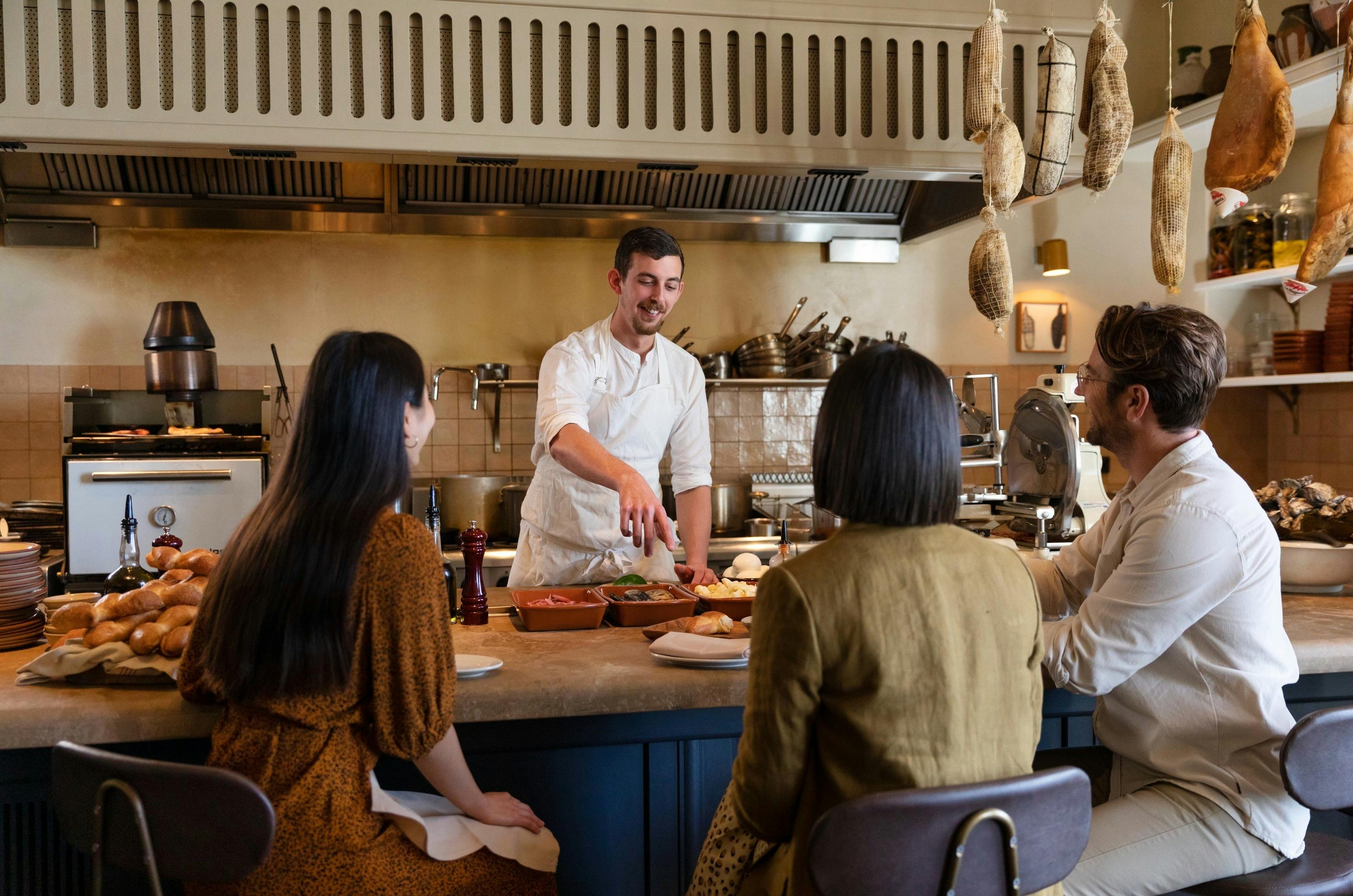 Chef preparing tapas at Una Mas restaurant at the Coogee Pavilion.