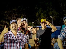 Group of blokes having fun on rodeo night