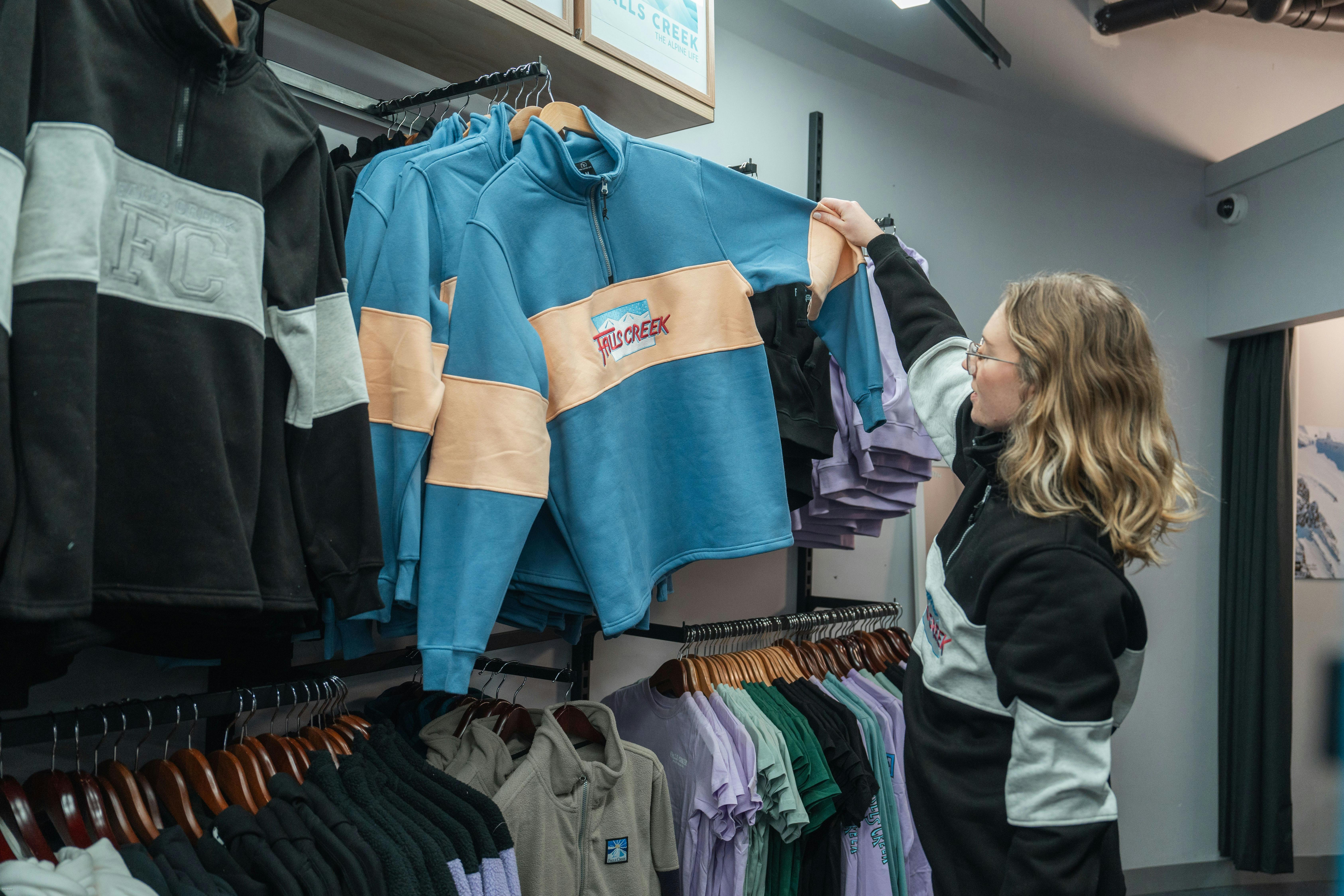 Woman shopping Falls Creek merch
