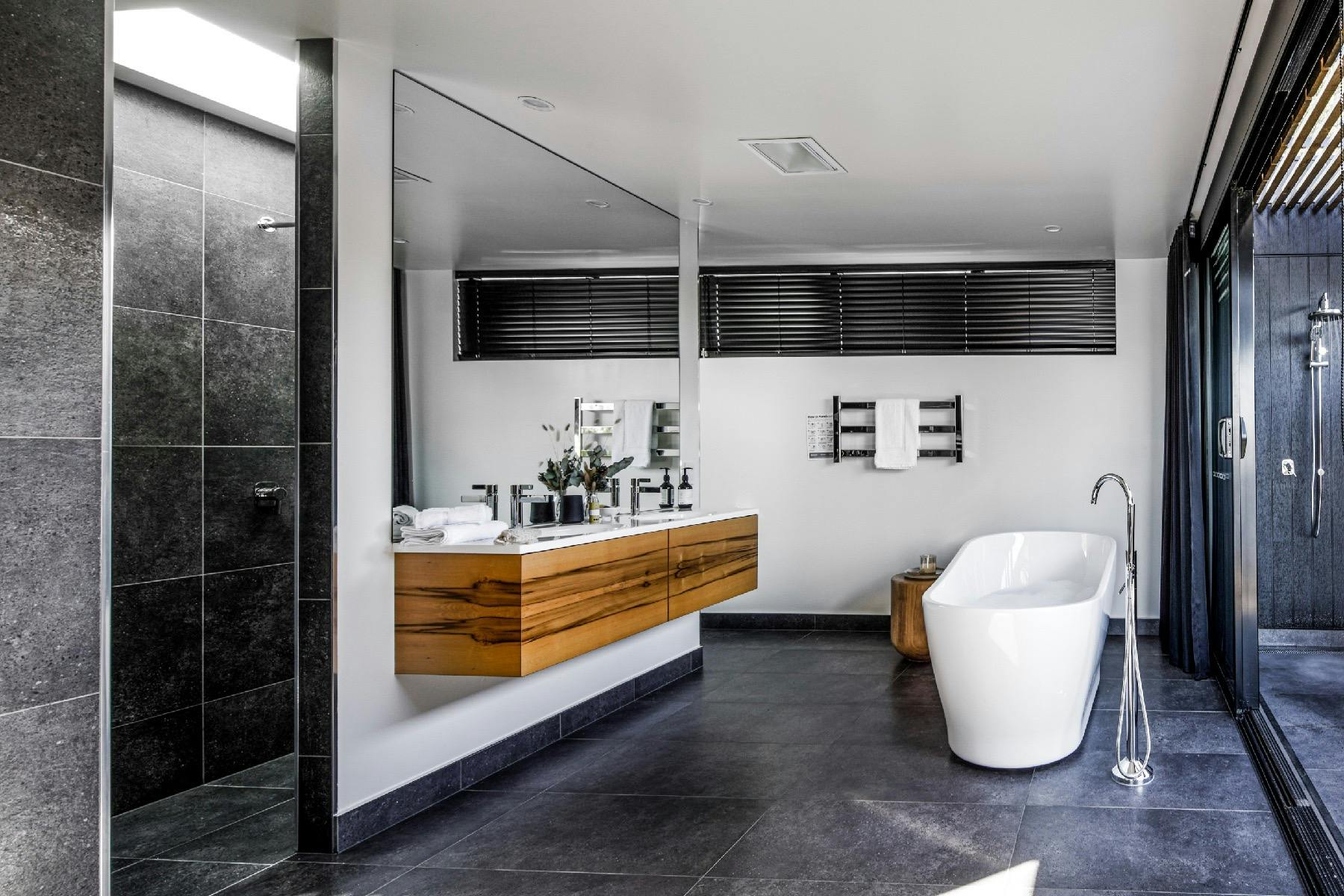 The second bedroom ensuite features a freestanding bath, double rain head showers.
