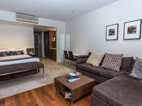 Enjoy the lounge area with couch and flat screen television and free wifi