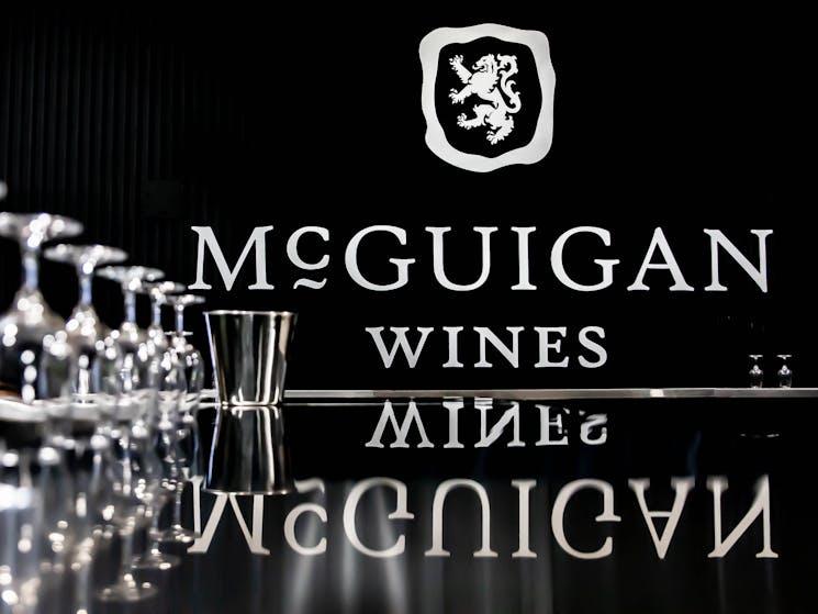 McGuigan Wines Logo in Cellar Door and wine glasses