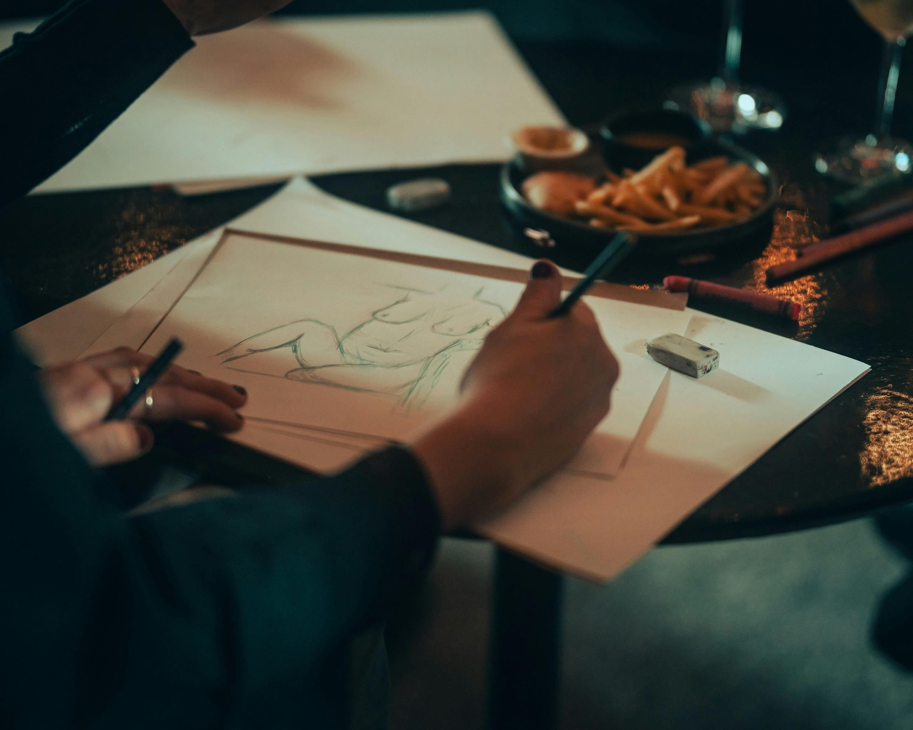 Drawing with hand holding pencil