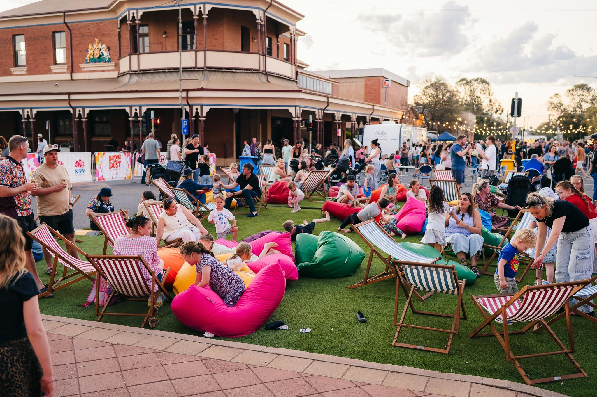 Bean bag and deck chair seating on fake grass at Beyond the Dust street festival