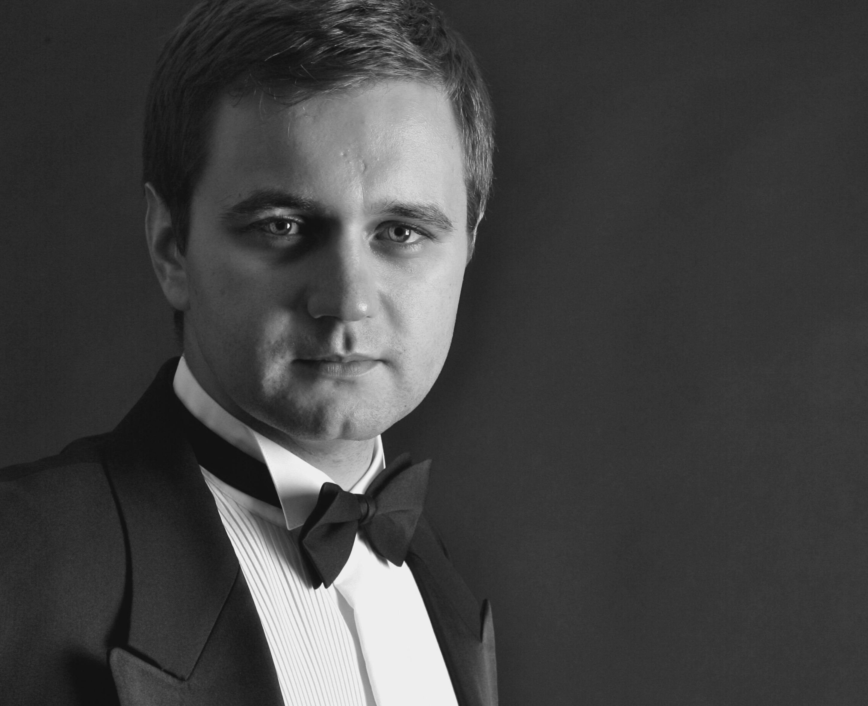 Alexey in black tie attire