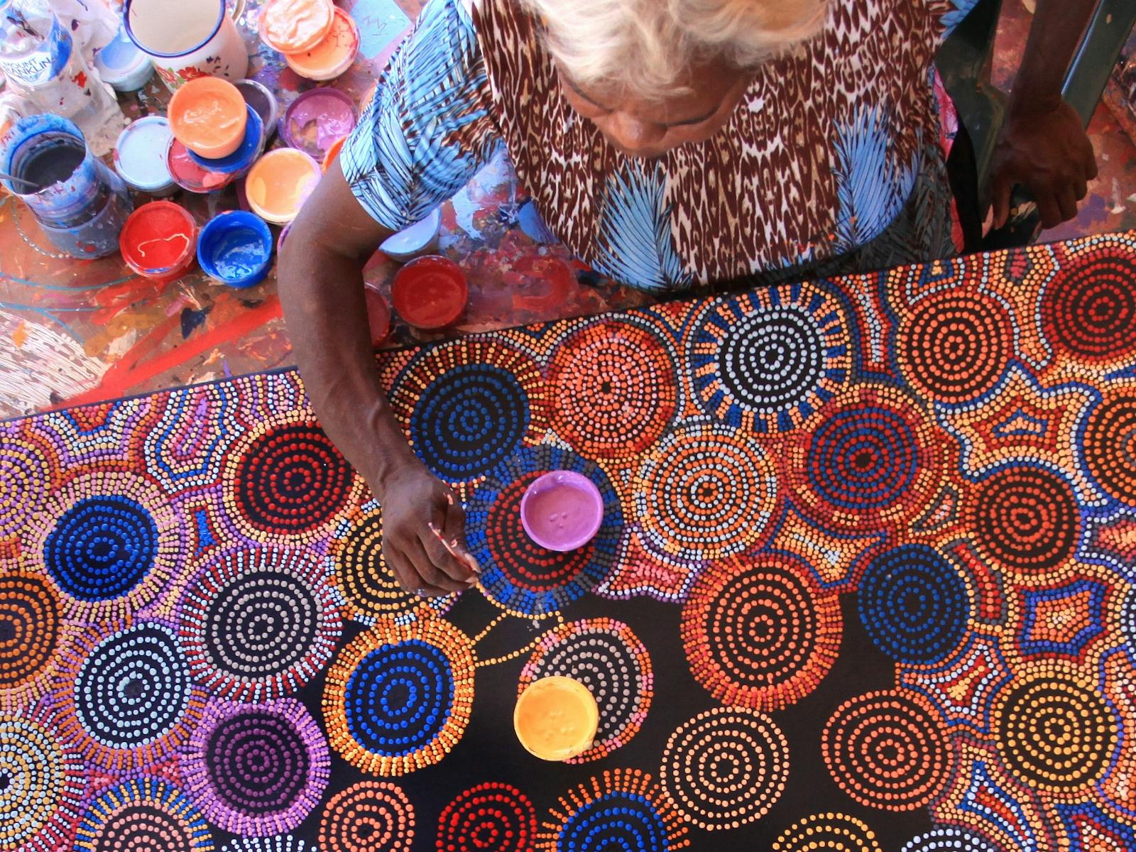 Aboriginal Artists doing a dot painting