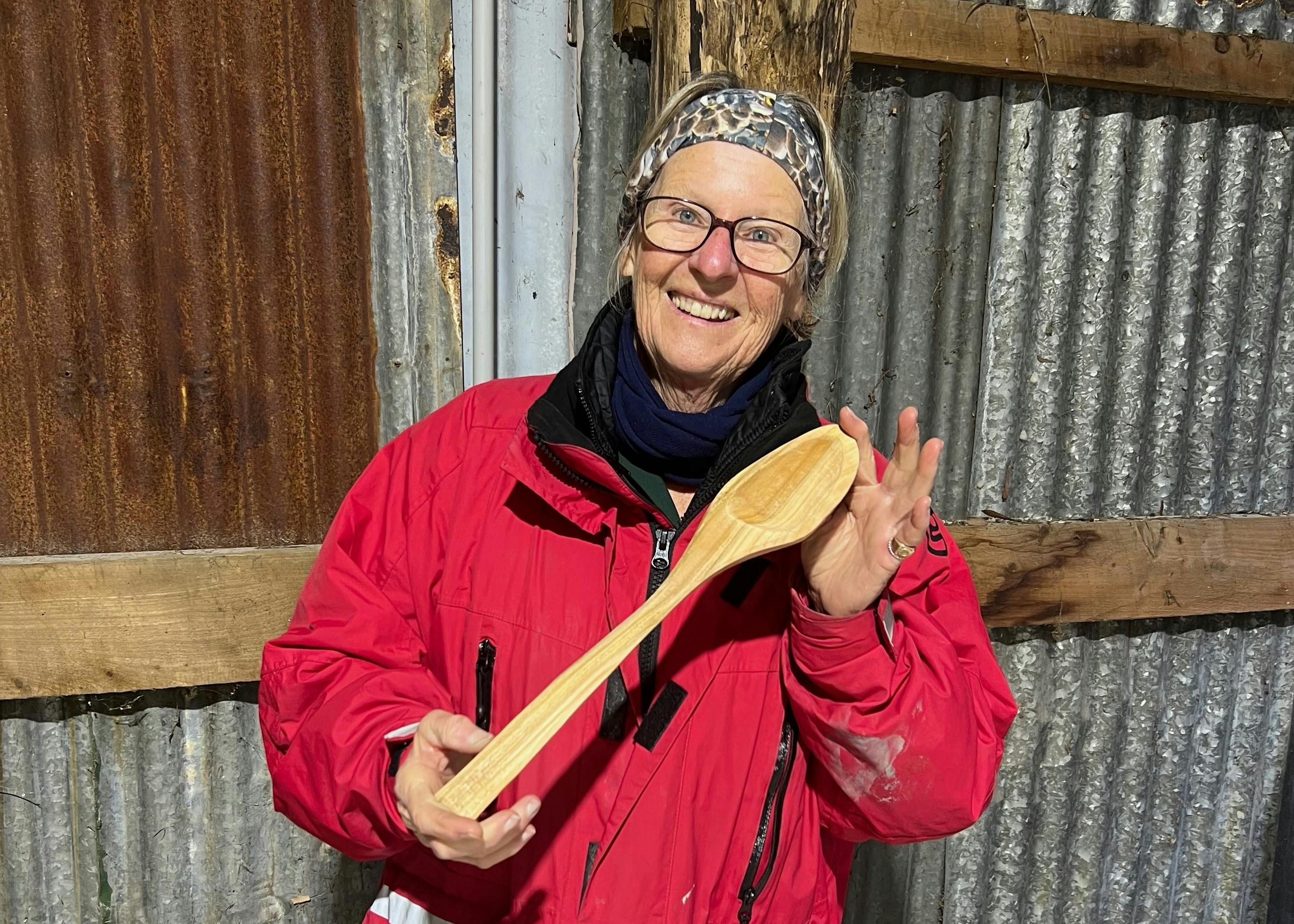 Smiling Participant Holding Her Finished Spoon