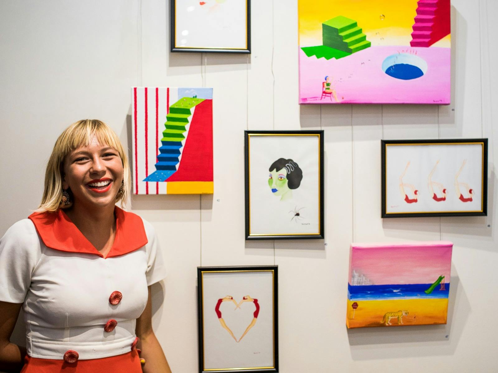 Surfer and Artist Jaleesa Vincent with her collection of artwork at the Festival art show