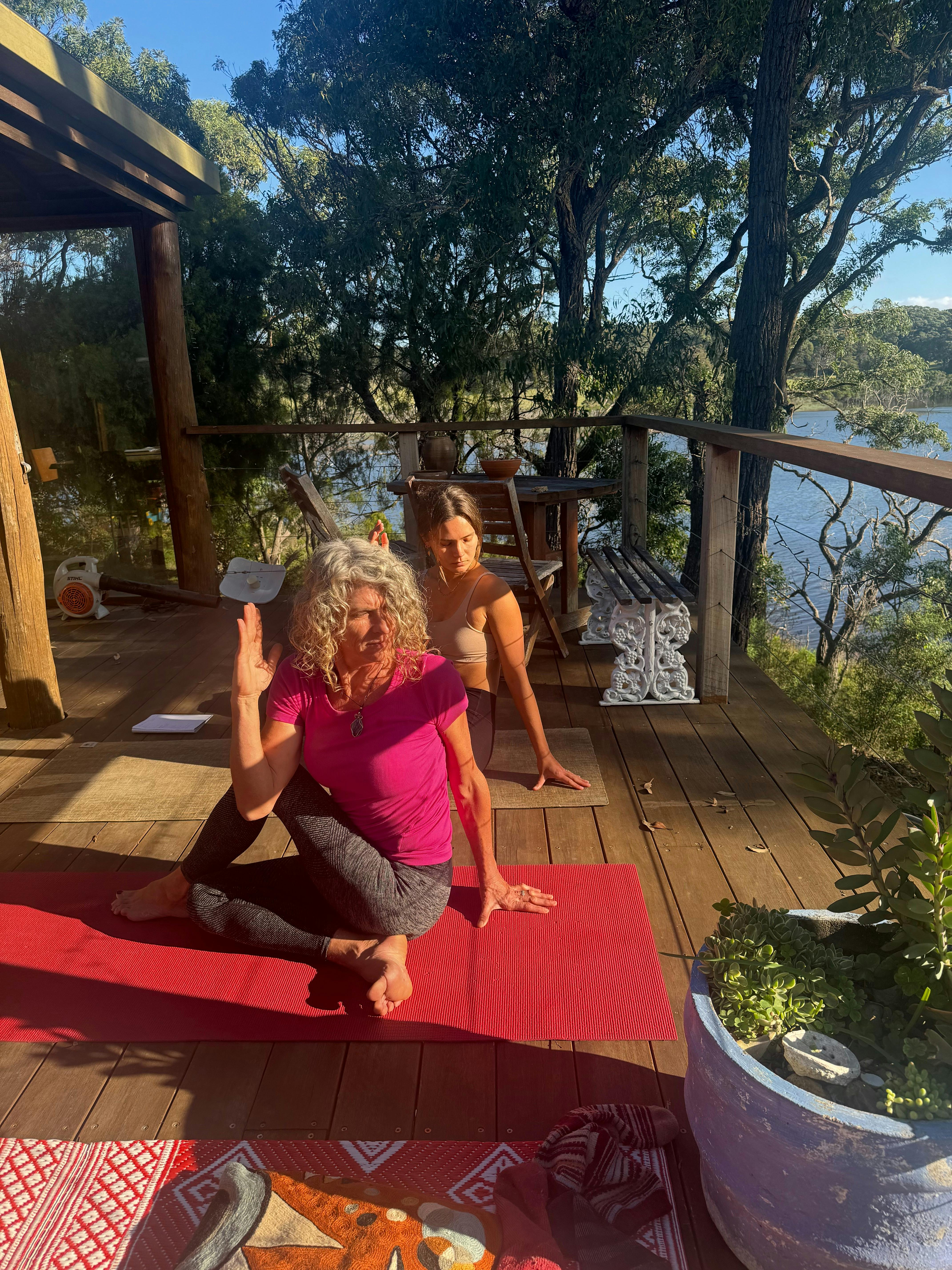 Yoga on a deck by the lake
