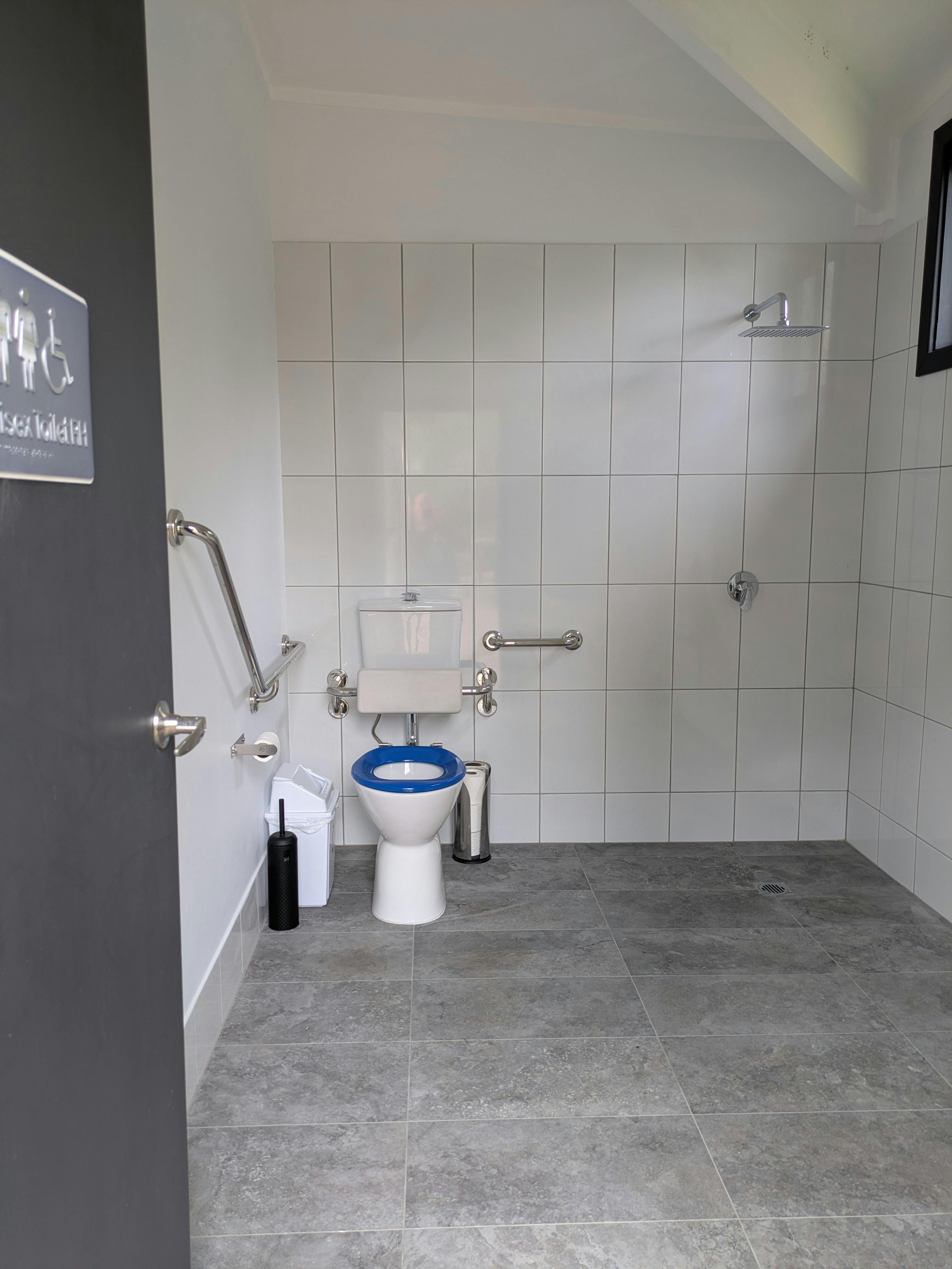 Our Unisex Disabled Toilet. With shower & grab rails on wall.