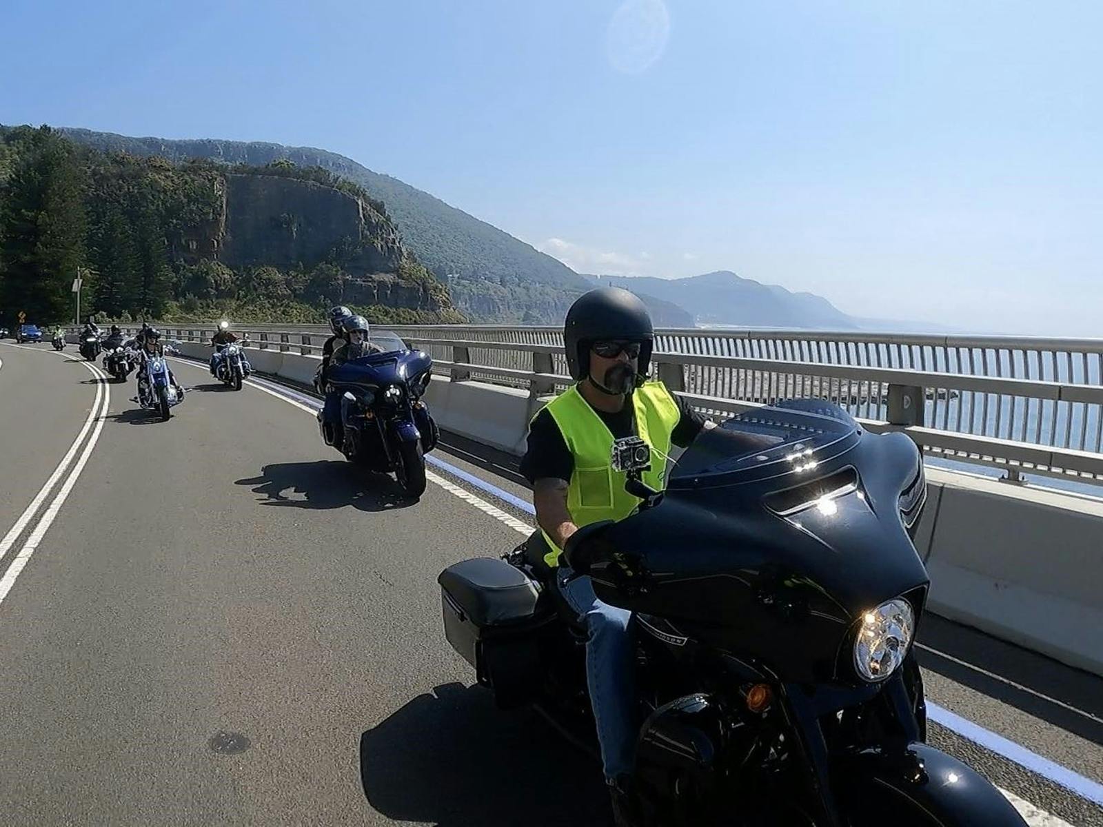 Motorcycles riding over Seacliff Bridge in NSW