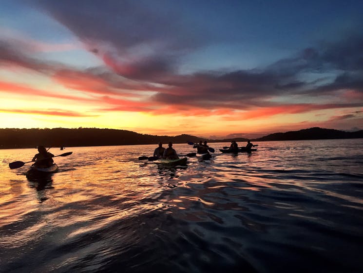 Kayaking with friends on Pittwater at sunrise.