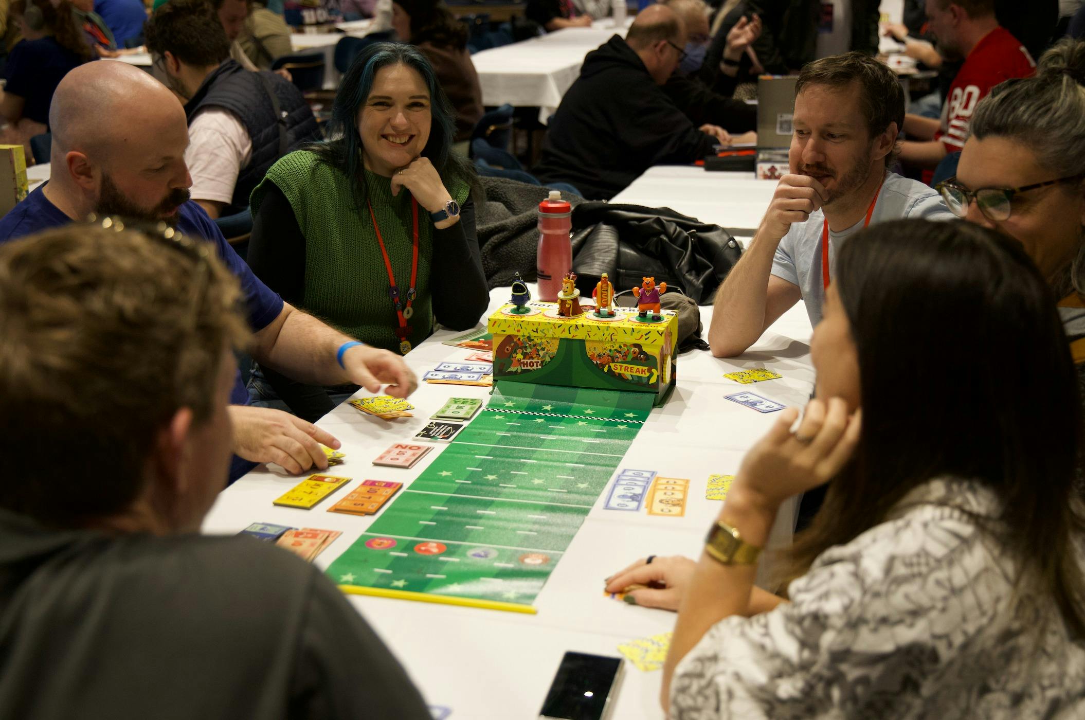 Group plays a racing game called Hot Streak with small figurine characters