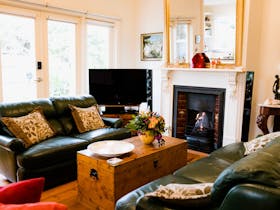 Heritage House lounge with gas log fire.