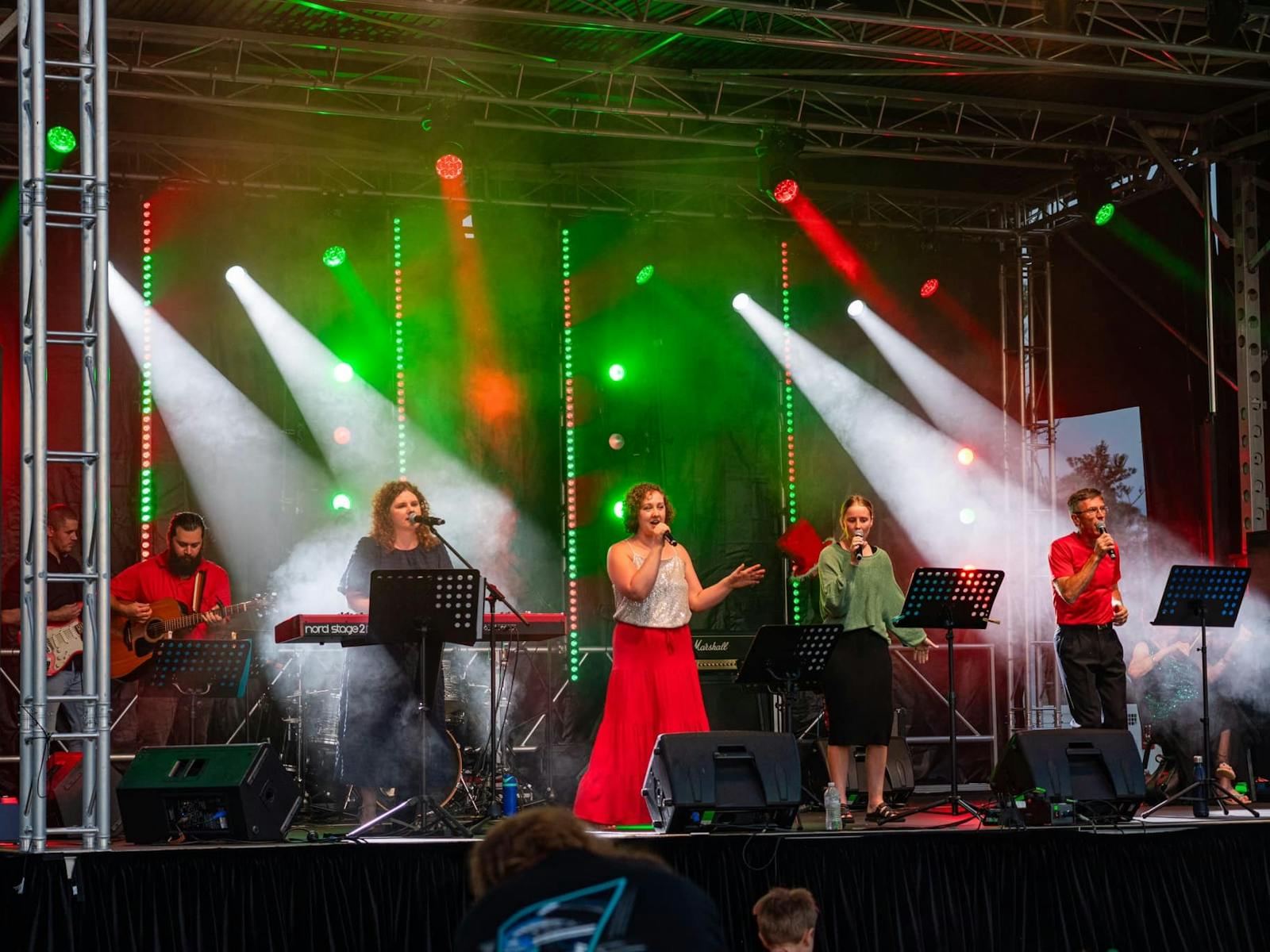 People singing on stage