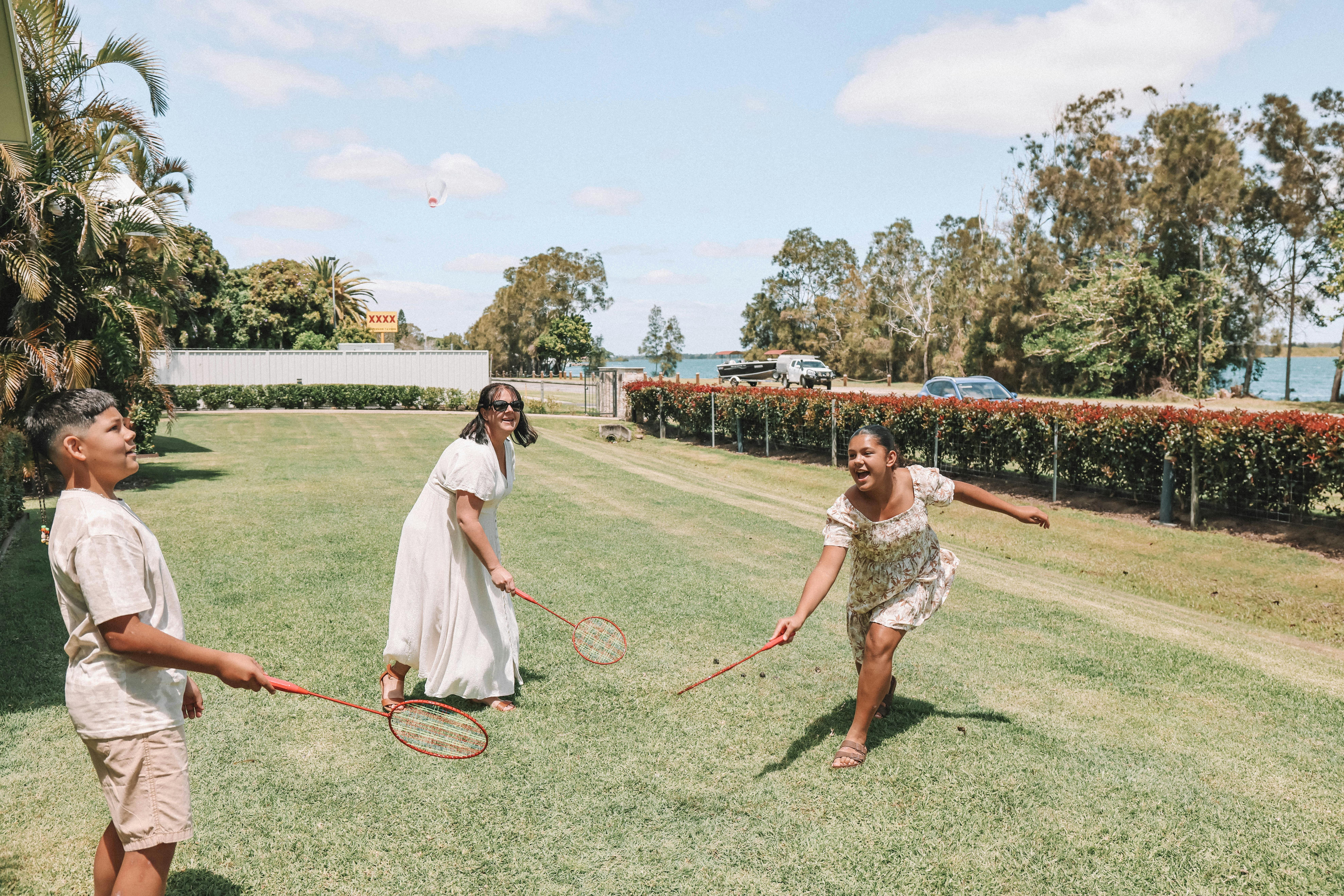 Guests laughing and playing a casual outdoor game