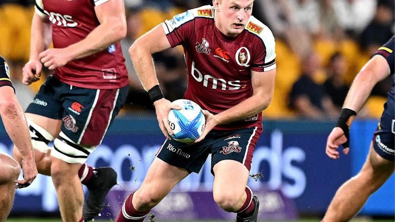 Tom Lynagh playing rugby union with the ball in hand for the Queensland Reds at Suncorp Stadium