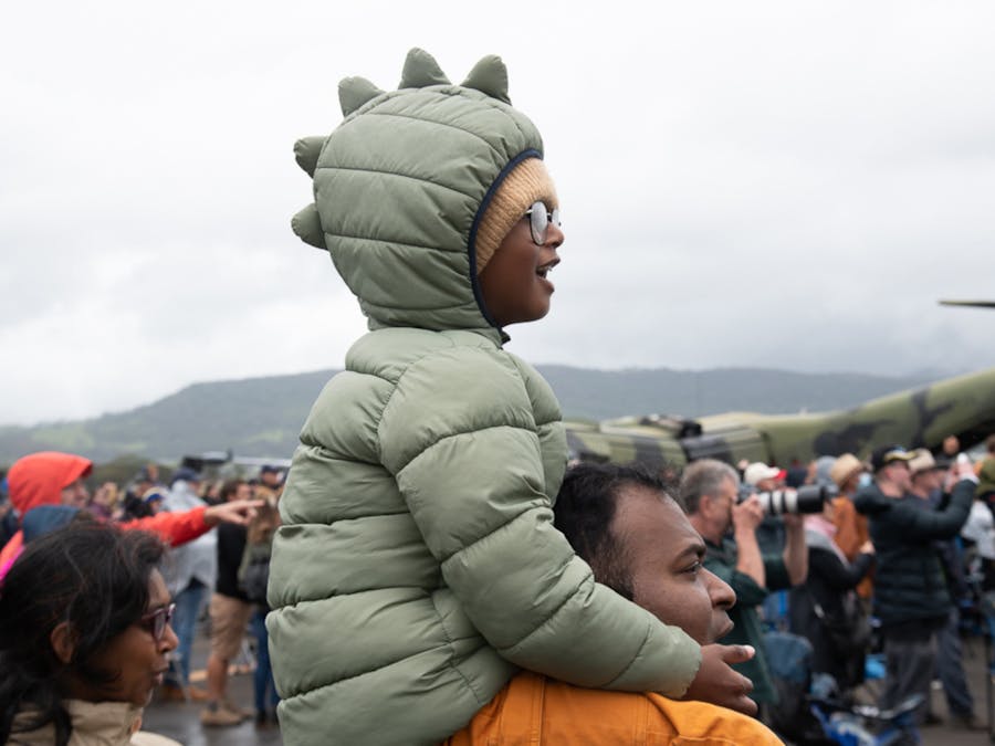 Child enjoying the flying display with height advantage
