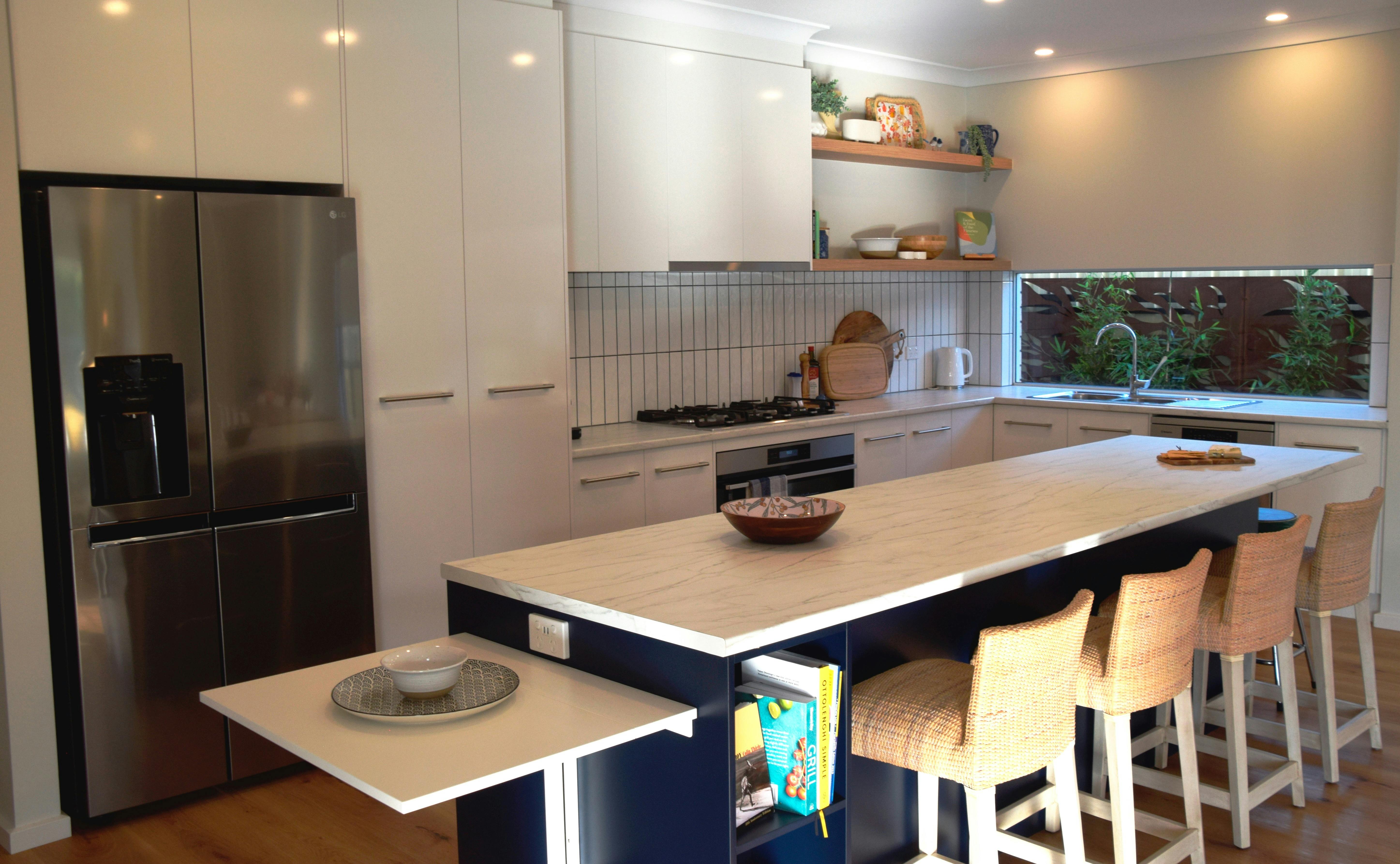 Large walk through kitchen with 6 person island with collapsible table. Under bench oven & microwave