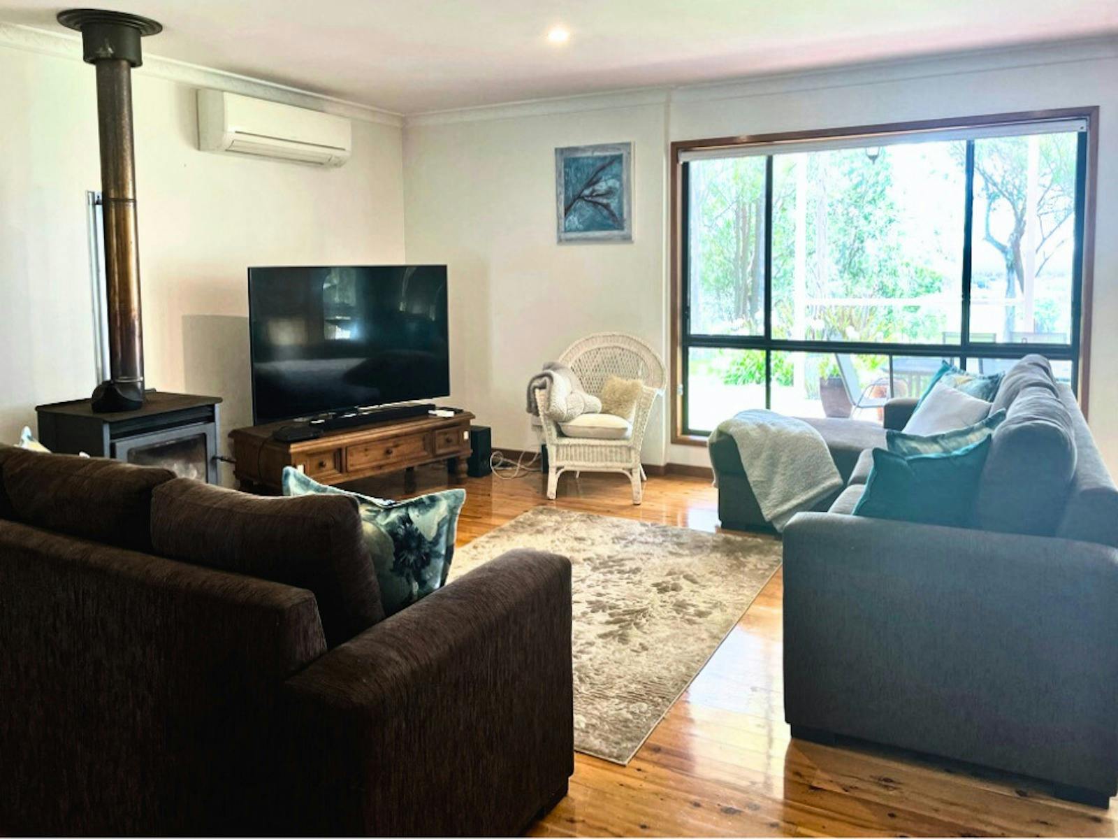 Lounge Area with Wood Fire Heater and Ducted Air Conditioning, Huge Windows to Look Out Over Views