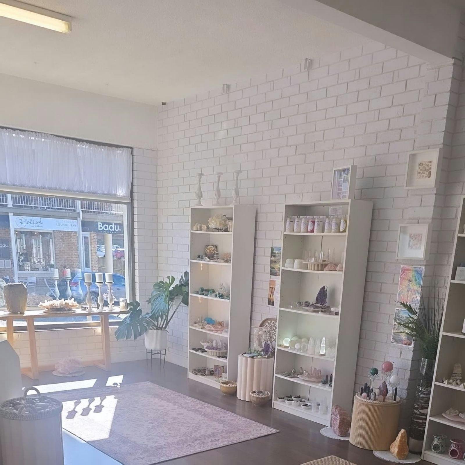 Assorted displays of crystals and candles inside shop