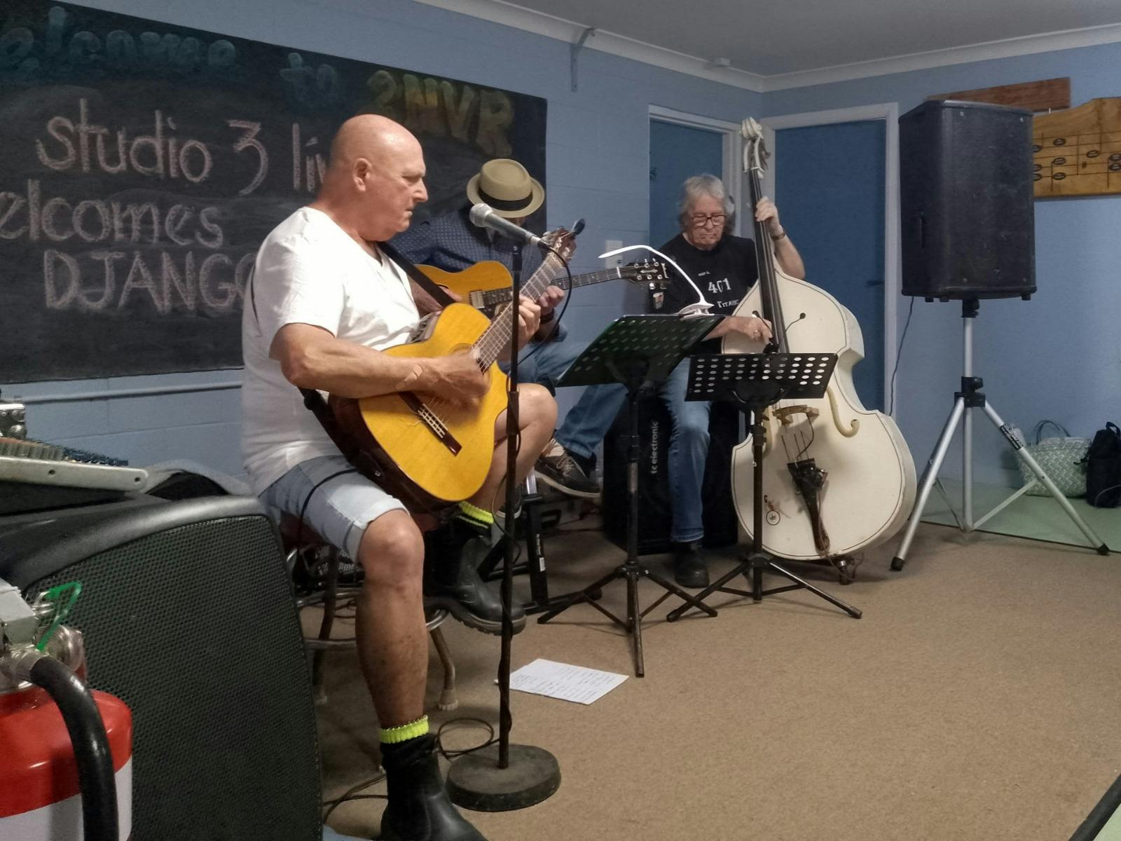Three musicians preforming in the Studio 3
