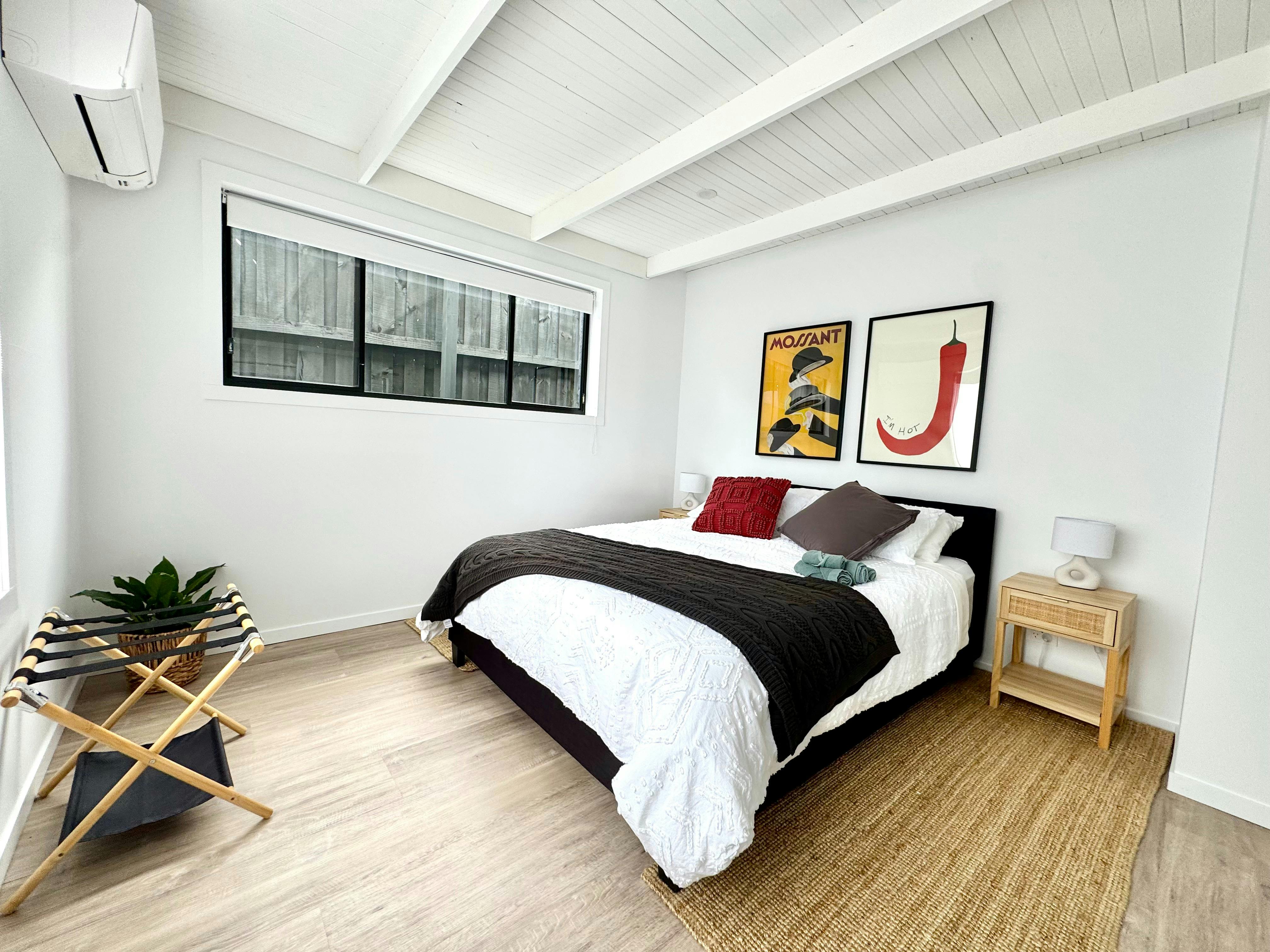 Bedroom with heat pump, queen size bed & closet