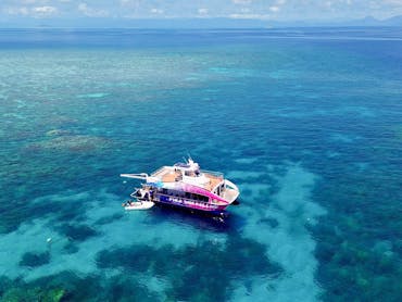 Drone shot of the Pure snorkelling boat at Briggs reef, snorkel site  fish bowl