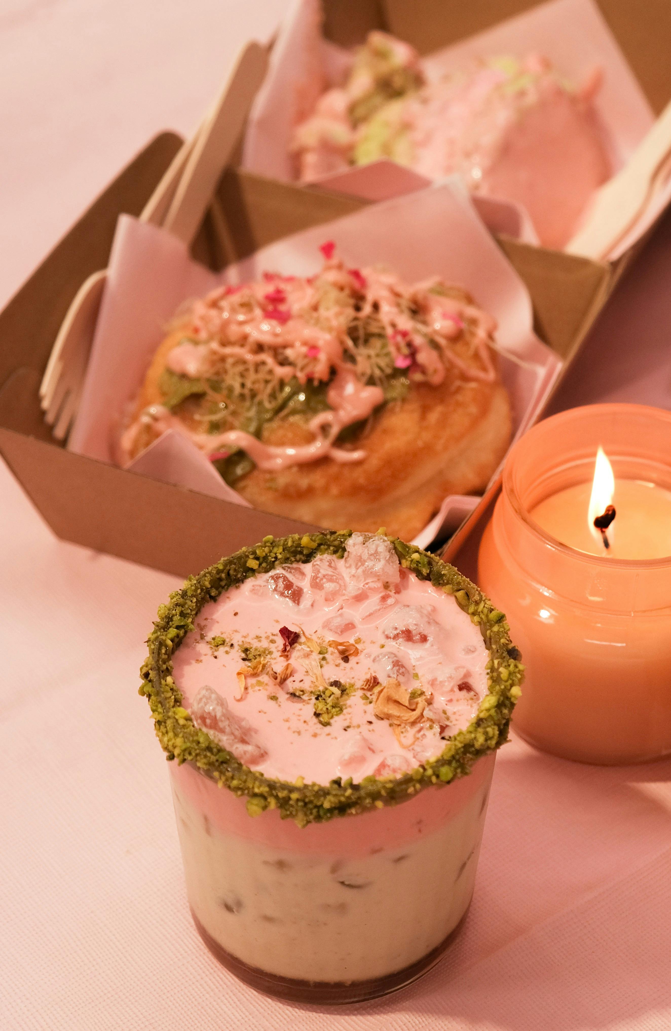 Pink pistachio cocktail and bombolone