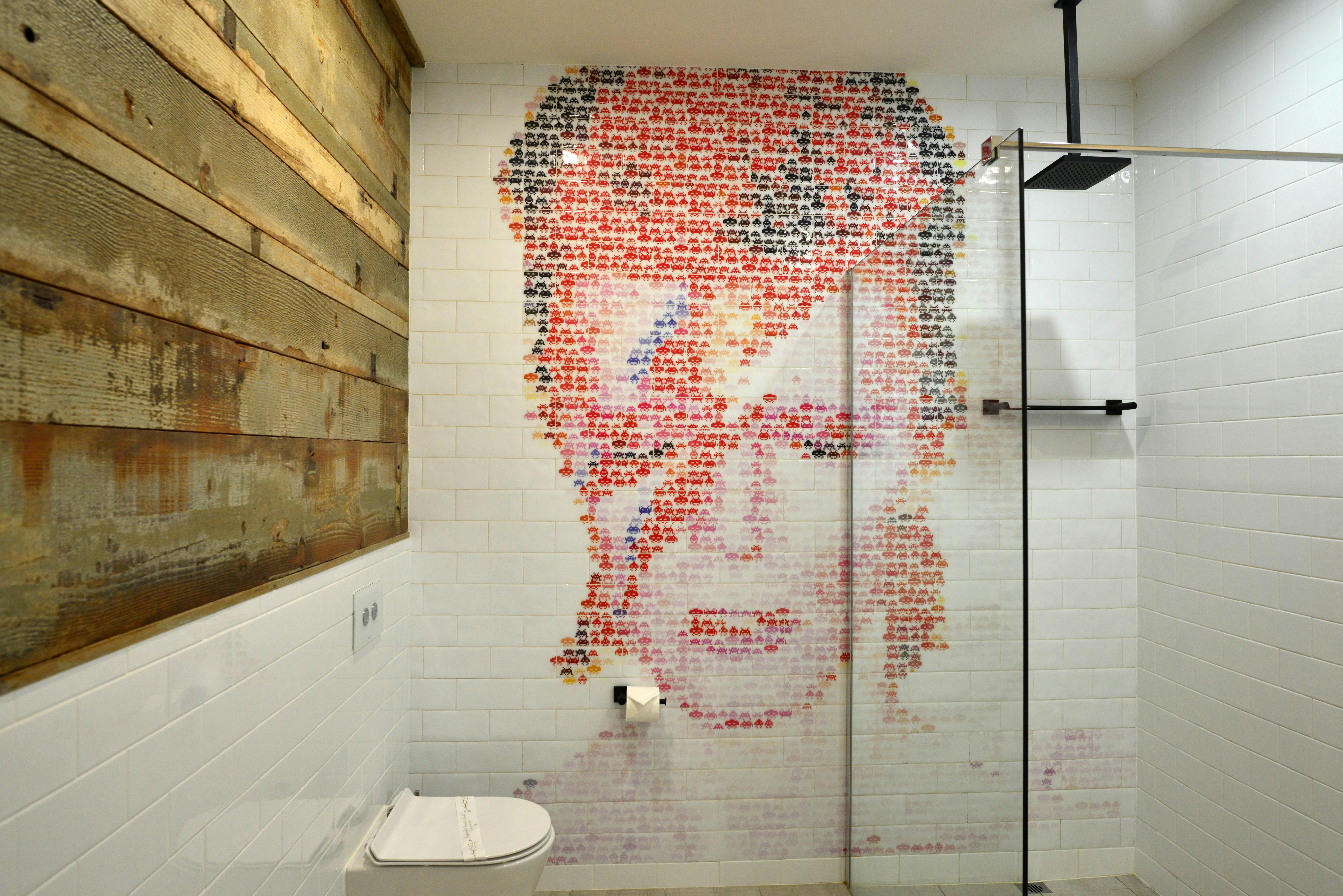 All bathrooms feature mosaic tiled wall of a music icon