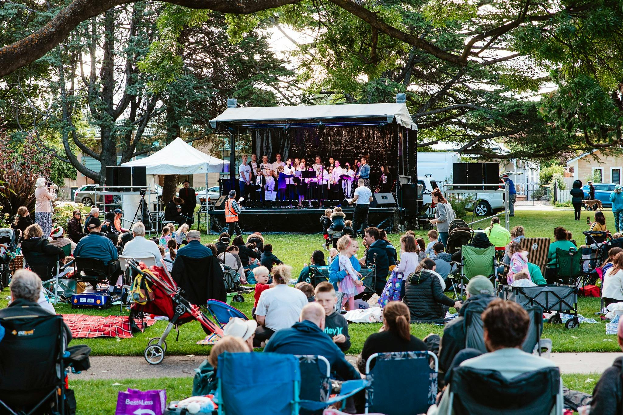 Stage and audience on lawn, 2022