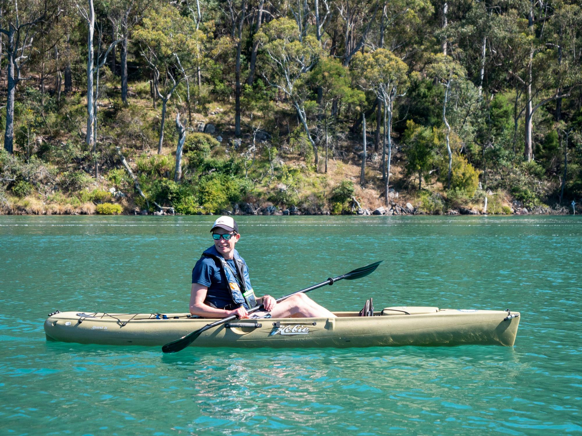 Guest resting in kayak along Pambula RIver